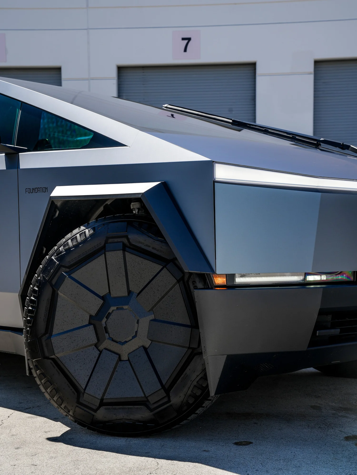 Tesla Cybertruck Ghost Metal Grey Blue after Window Tint and Vinyl Wrap, front wheel and body view