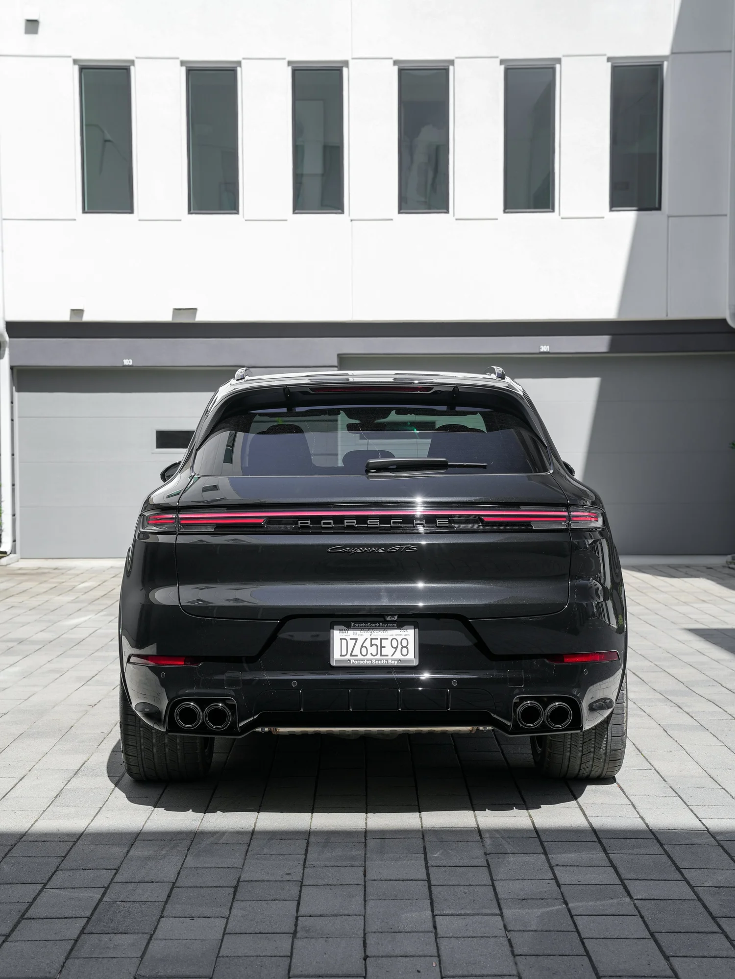Black Porsche Cayenne GTS after Paint Protection Film (PPF), Window Tint and Ceramic Coating, rear-right three-quarter view