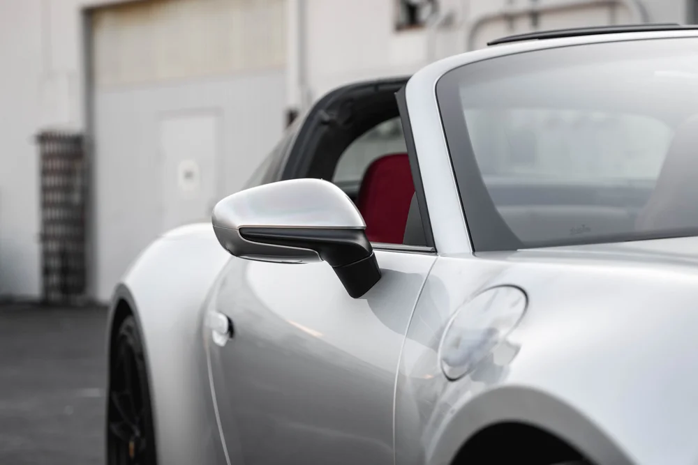 Targa silver mirror, front door and fender with soft building reflections