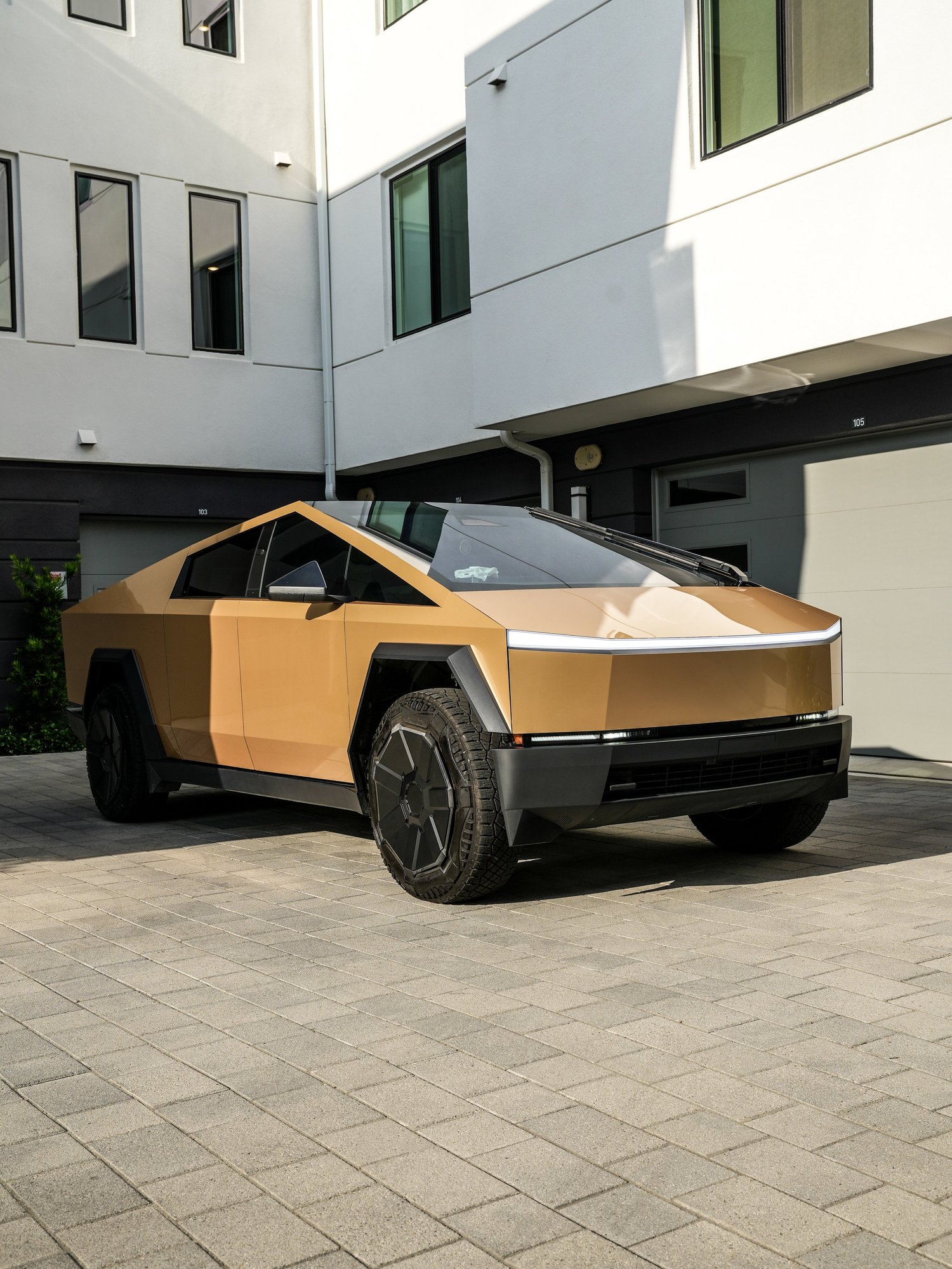Tesla Cybertruck Milan Gold after Paint Protection Film (PPF) and Window Tint, front-left three-quarter view