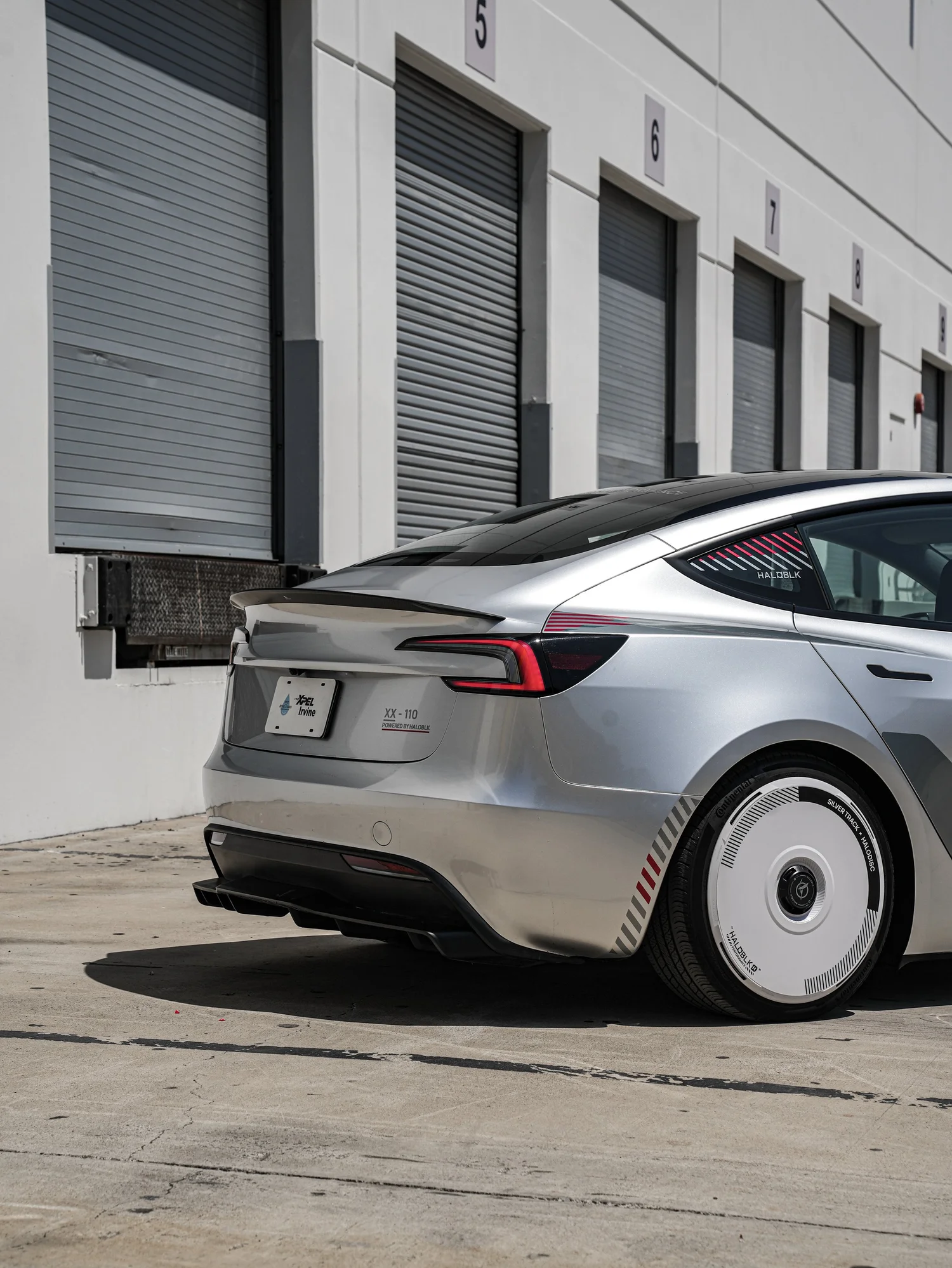 Tesla Model 3 Halo Edition Custom Wrap after Vinyl Wrap, low-angle rear view
