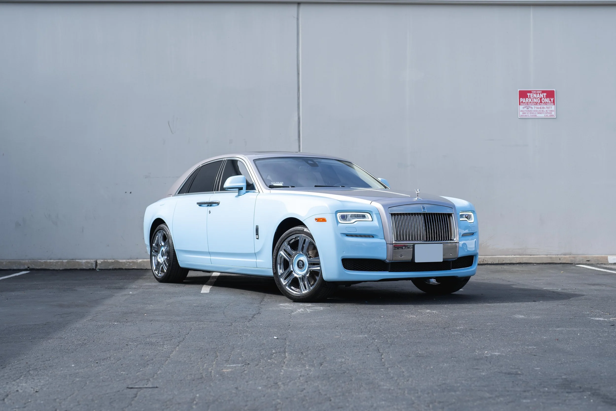 Rolls-Royce Ghost — complete front three-quarter landscape view showing the long sedan and bright wheels