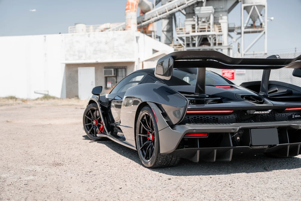 McLaren Senna closer rear three-quarter view showing the rear wheel, wing and diffuser