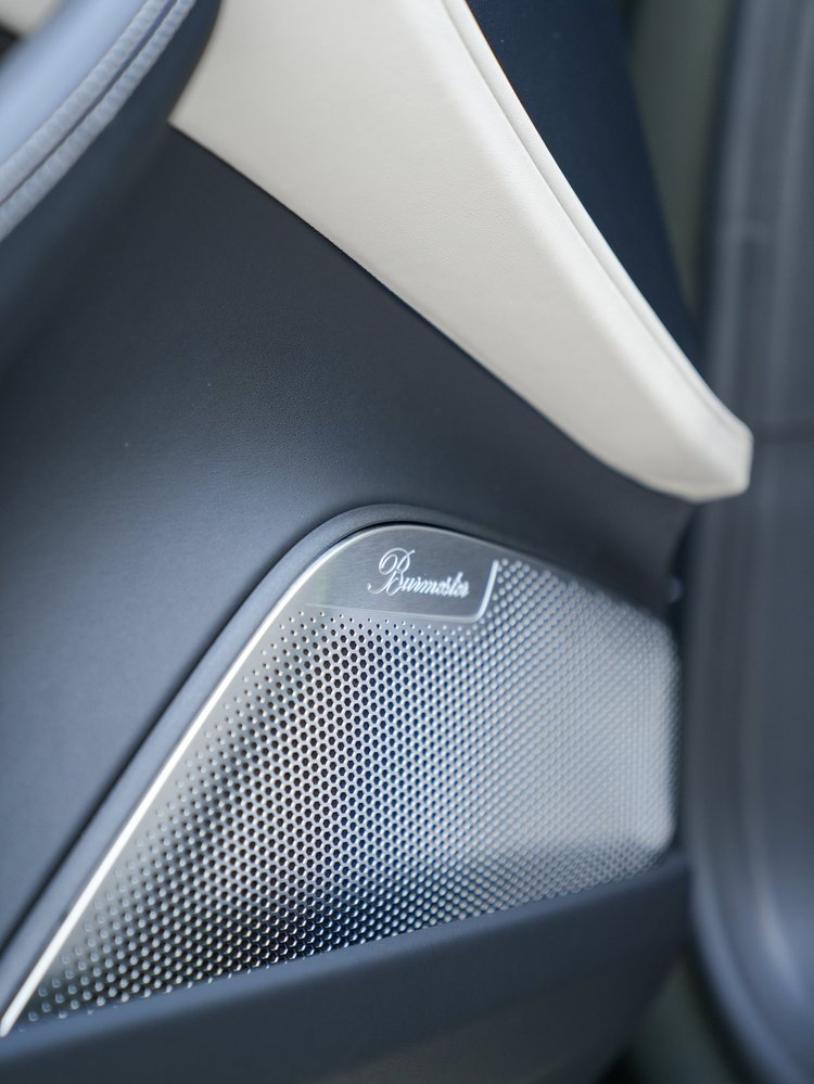 Silver perforated Burmester speaker grille in the door trim