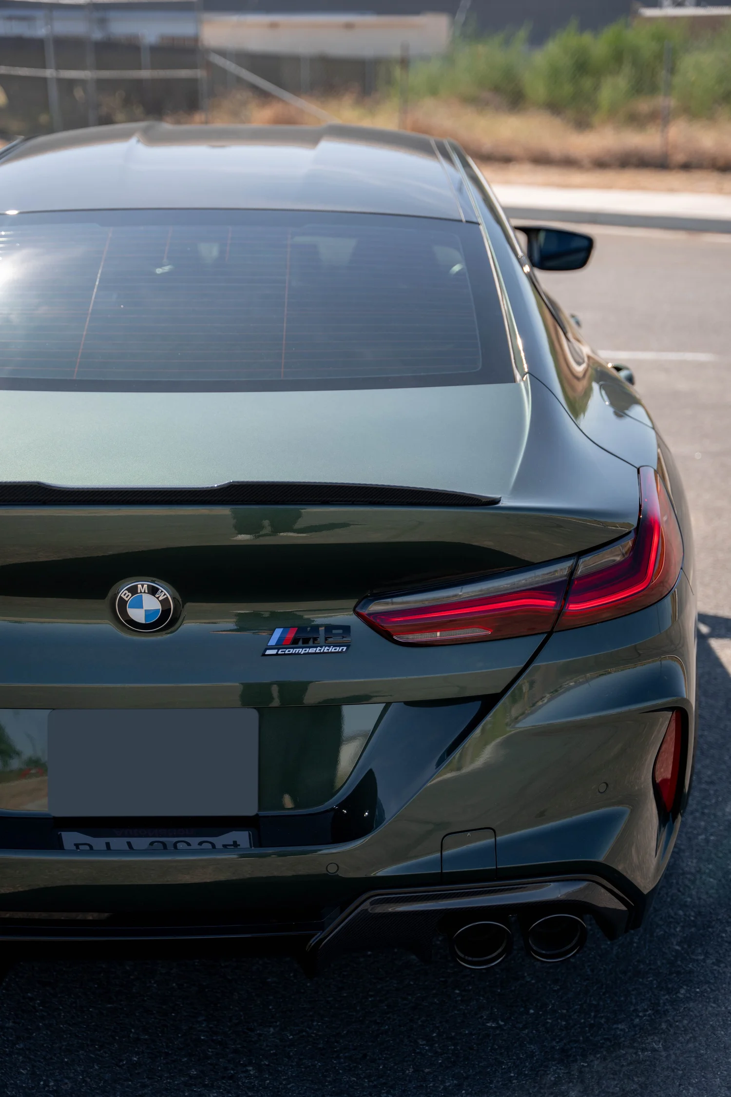 BMW M8 Competition after Paint Protection Film (PPF), Window Tint and Ceramic Coating, rear body and taillight view