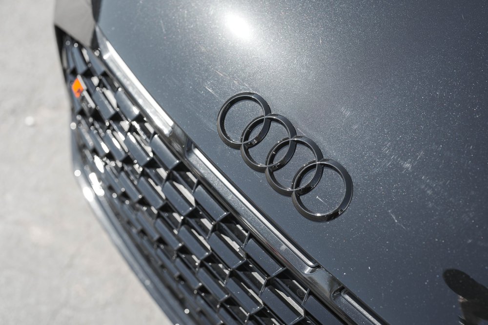 Audi rings on the dark R8 hood above the patterned front grille