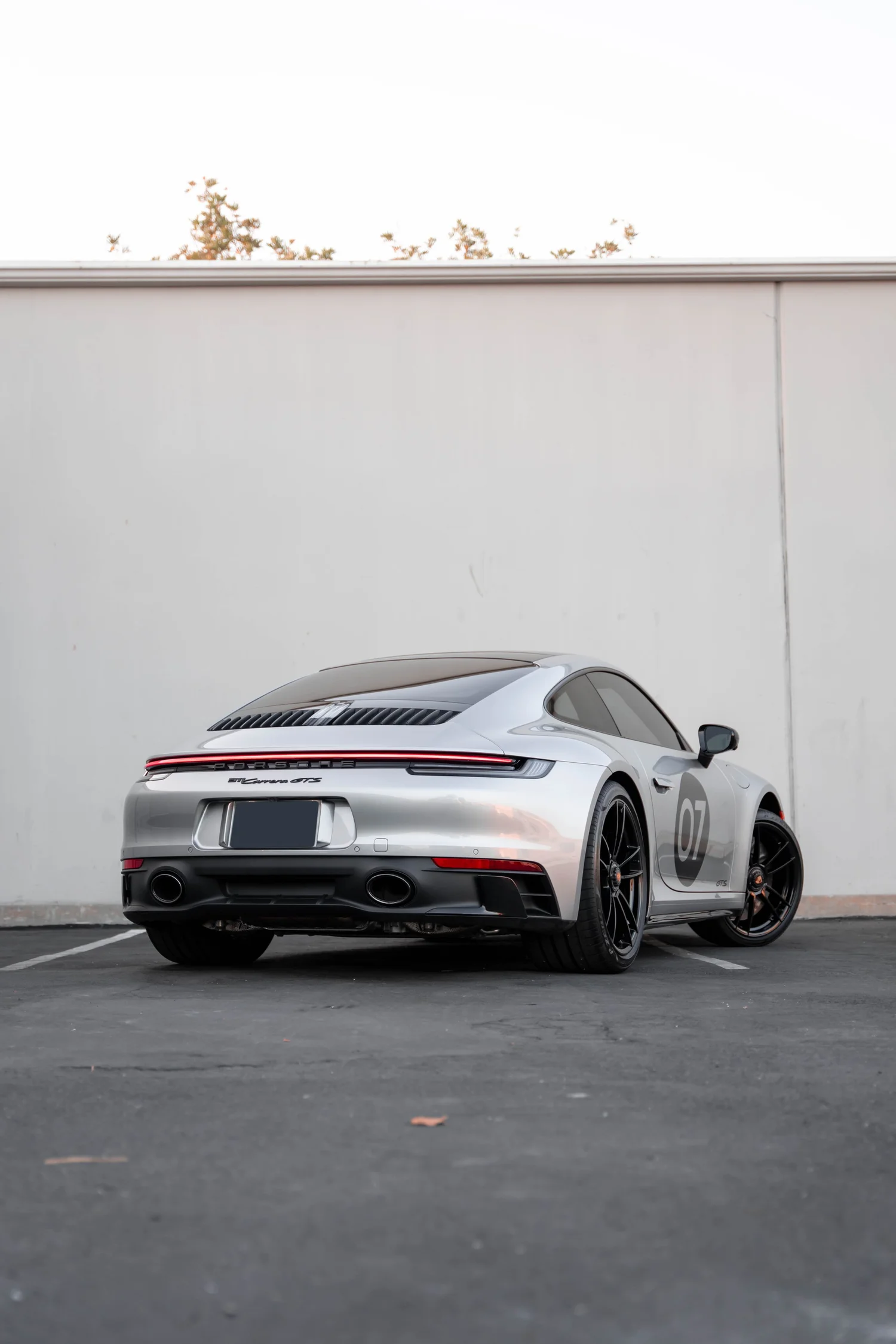 Porsche 911 Carrera GTS (992.1) after Paint Protection Film (PPF), Window Tint, Ceramic Coating and Custom Graphics, direct rear view
