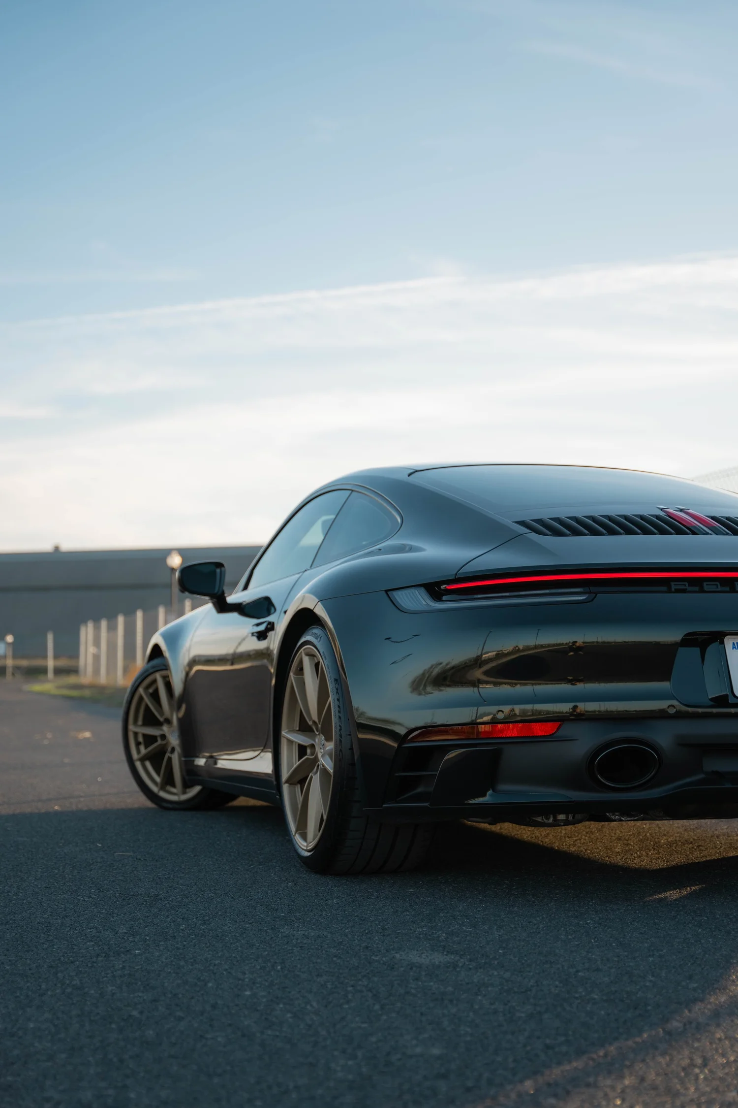 Porsche 911 Carrera Wrapped in British Green after Vinyl Wrap, rear-quarter and wheel view