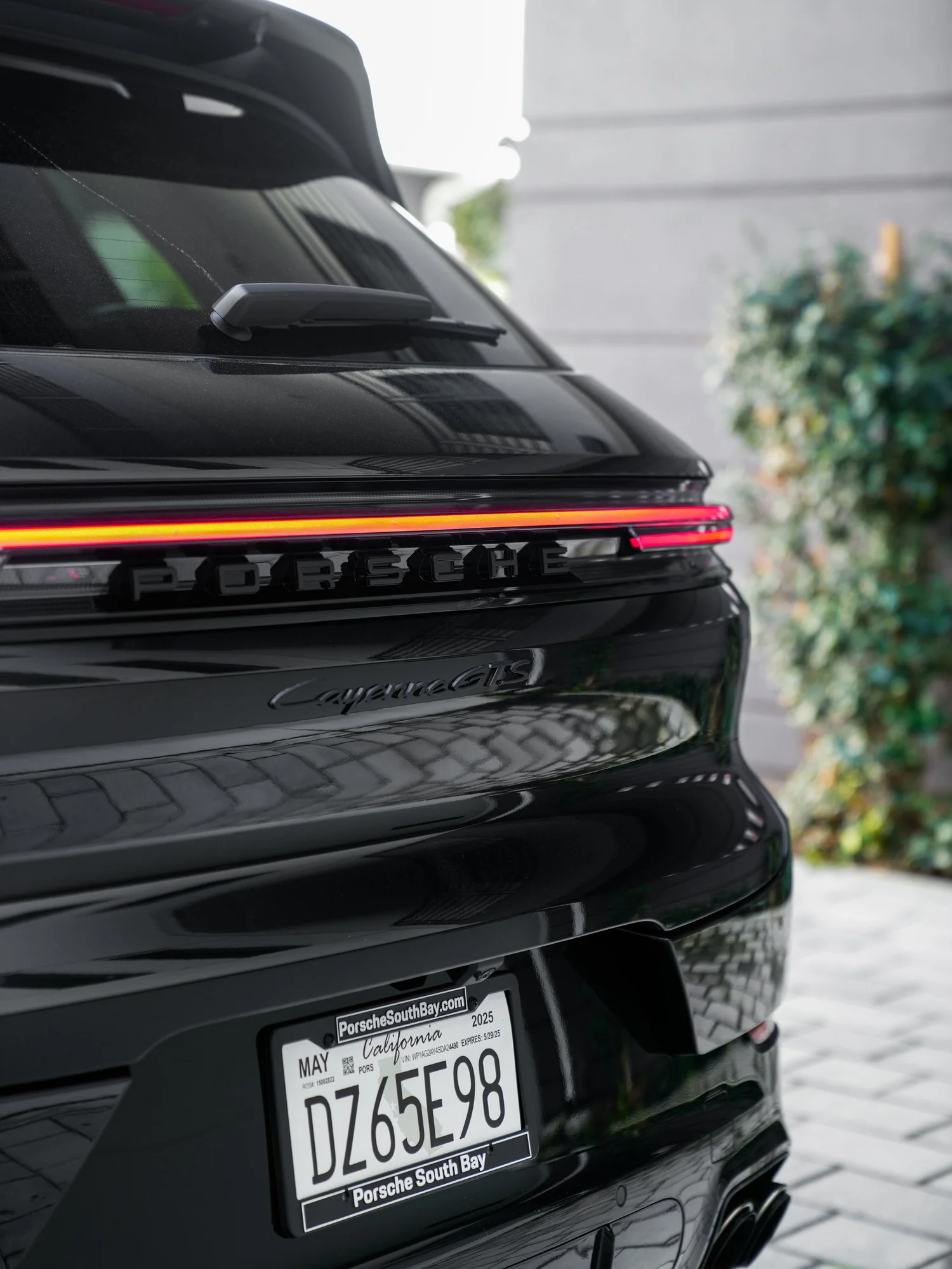 Black Porsche Cayenne GTS after Paint Protection Film (PPF), Window Tint and Ceramic Coating, rear body and taillight view