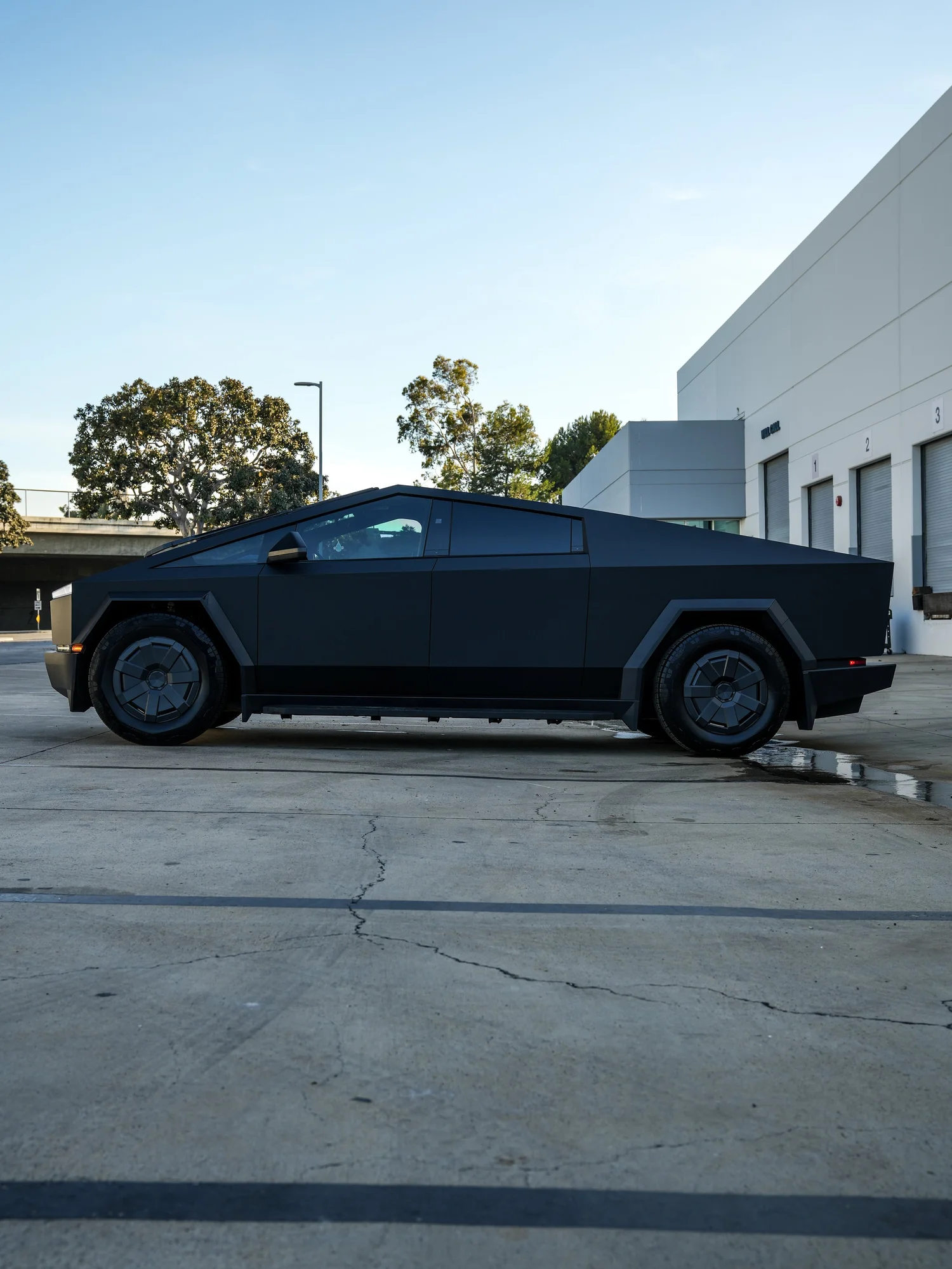 Tesla Cybertruck full driver-side profile after PROTEK matte black PPF and window tint