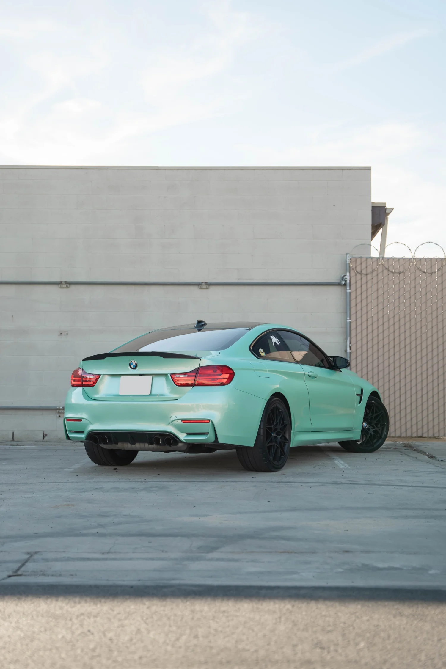 BMW M4 Mint Green after Vinyl Wrap, wide rear three-quarter view