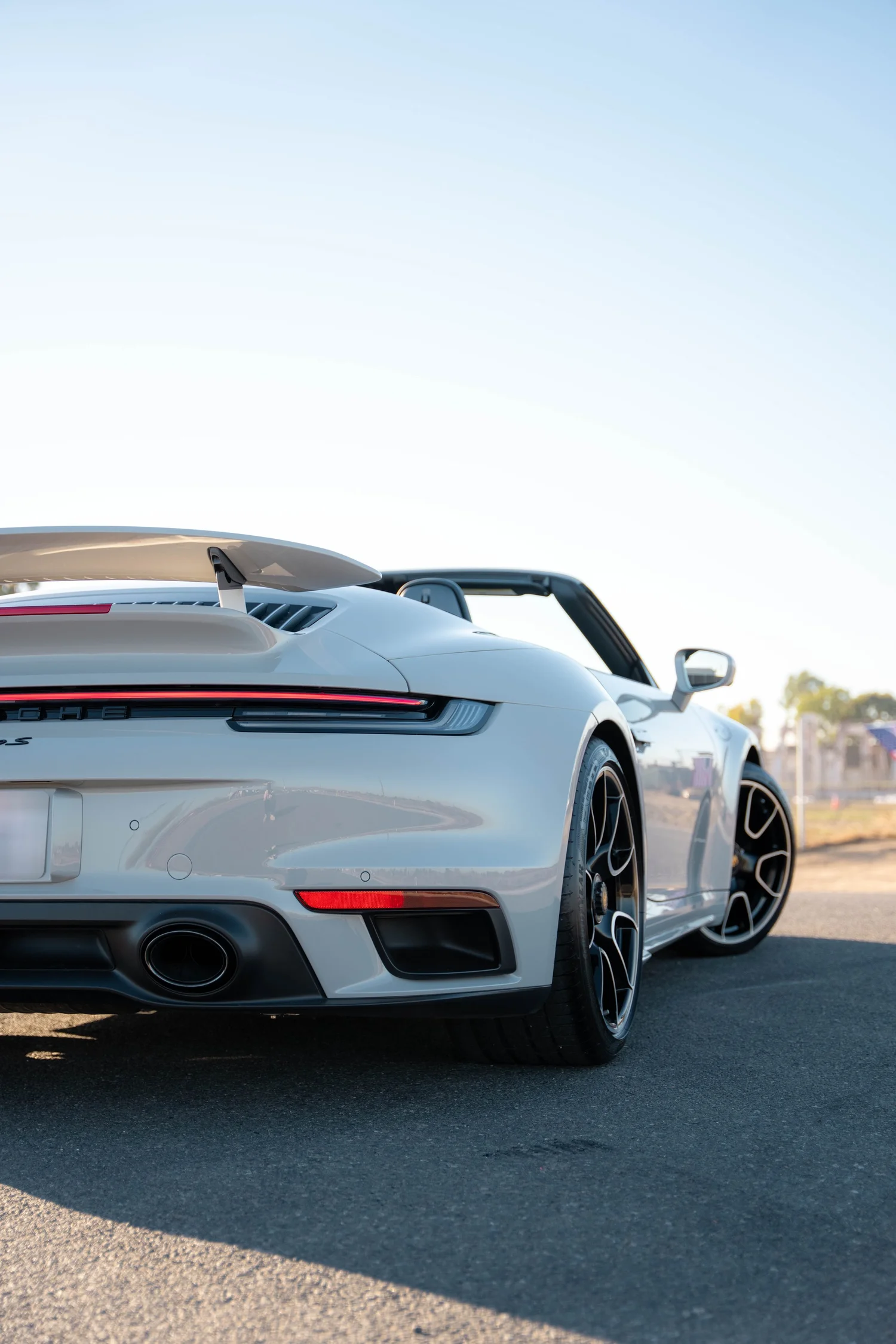 Chalk Porsche 911 Turbo S after Paint Protection Film (PPF), Window Tint and Ceramic Coating, low-angle rear view