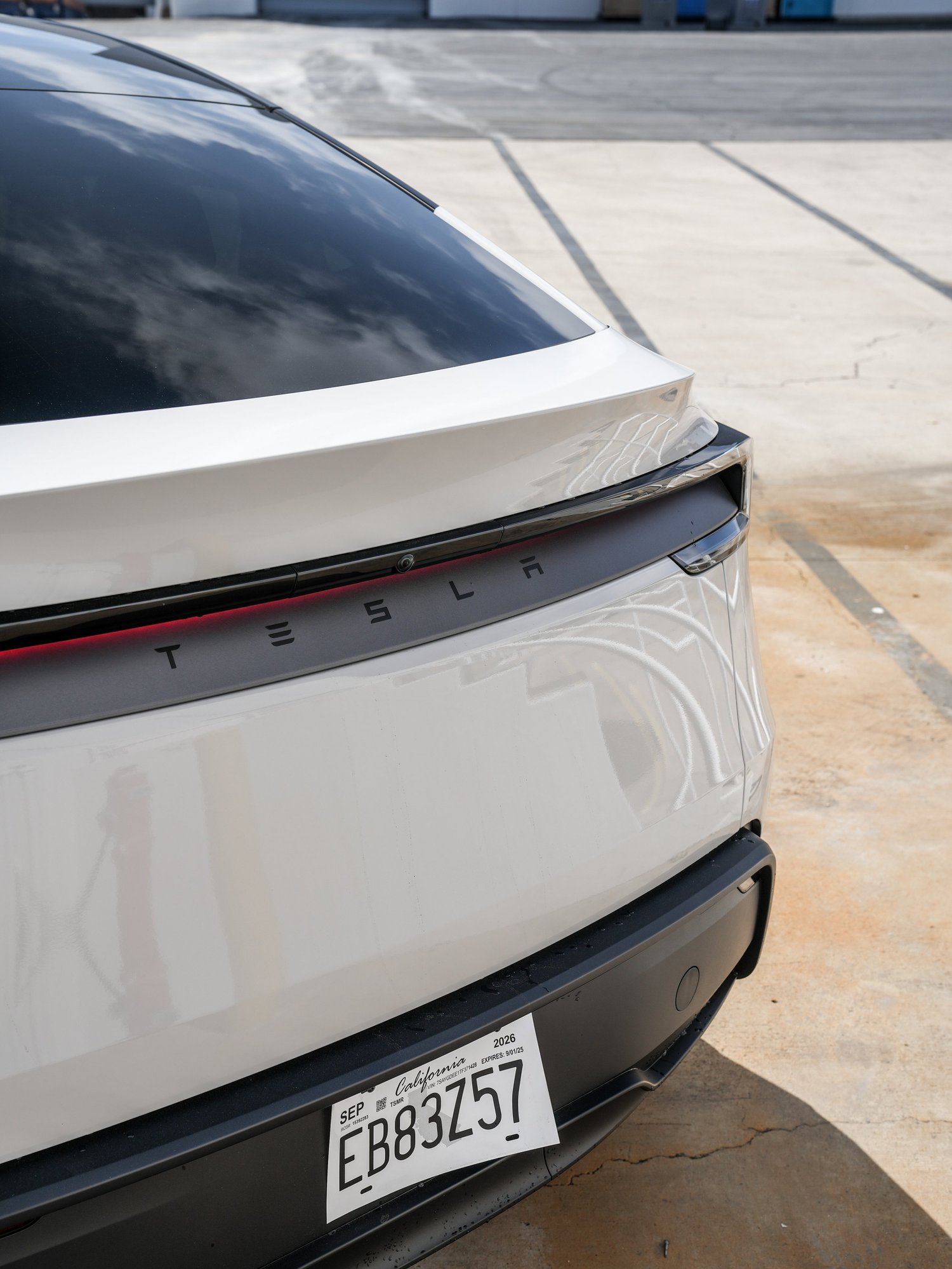 Tesla Model Y Chalk Grey Wrap after Vinyl Wrap, rear bumper and taillight detail