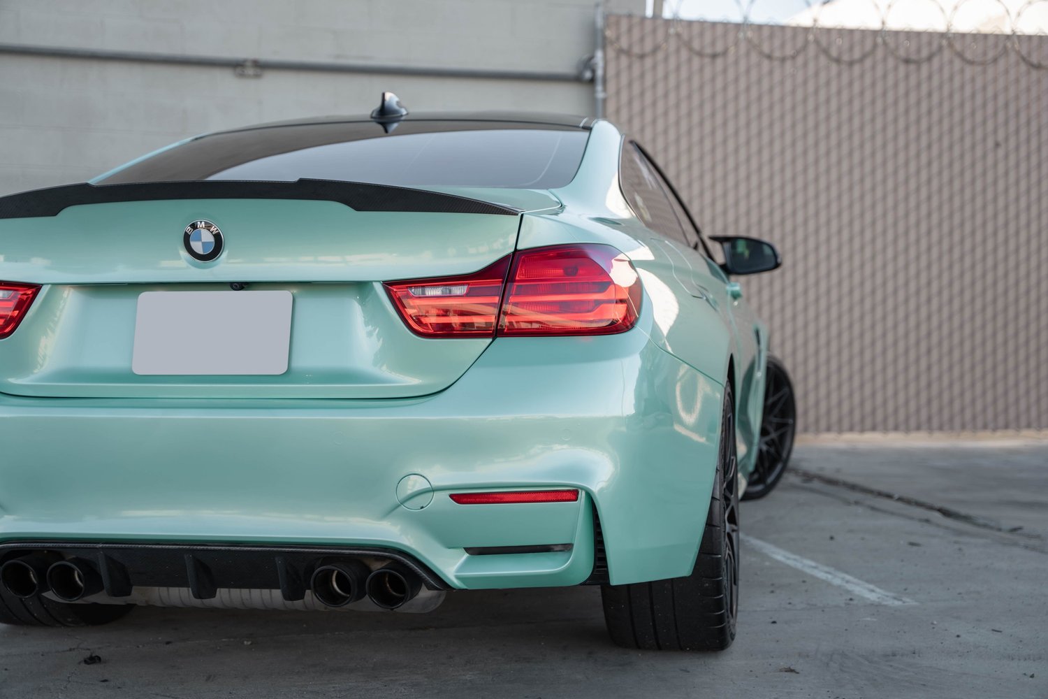 BMW M4 Mint Green after Vinyl Wrap, rear-right three-quarter view