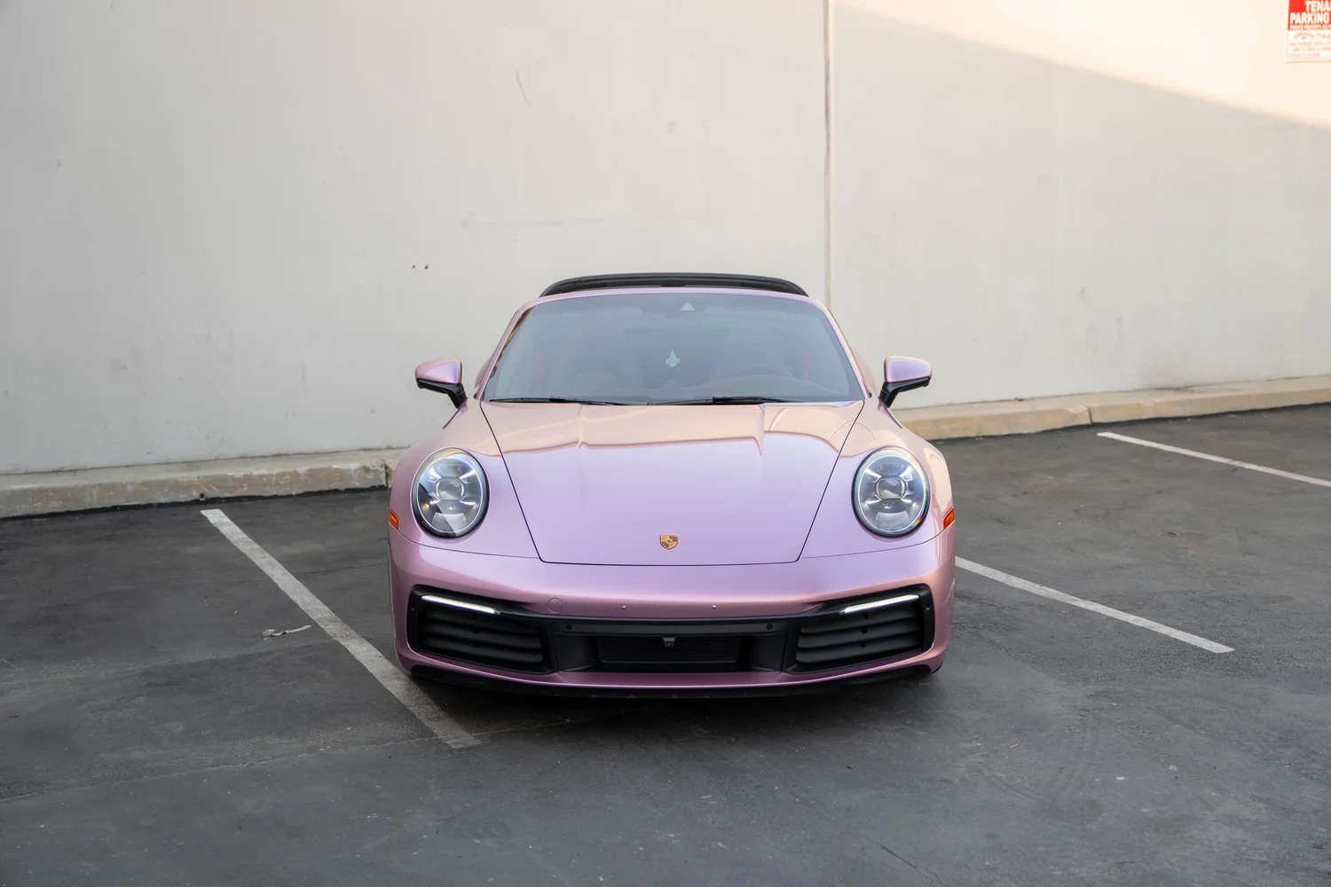 Porsche 911 Metallic Pink after Vinyl Wrap, high-angle complete-vehicle view