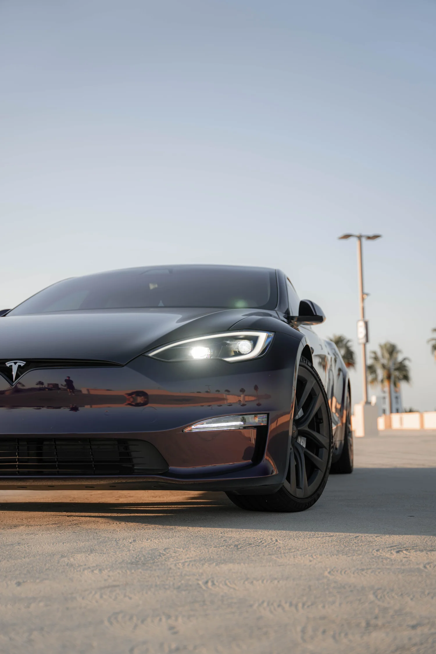 Tesla Model S Midnight Purple after Vinyl Wrap, low-angle front view