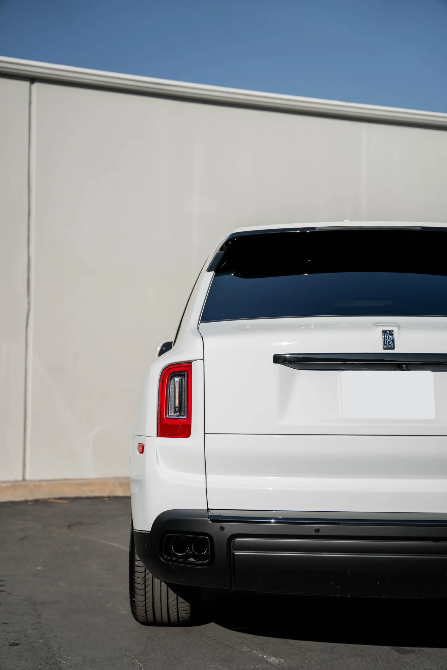 White Rolls-Royce Cullinan after Paint Protection Film (PPF), Window Tint and Ceramic Coating, close rear view