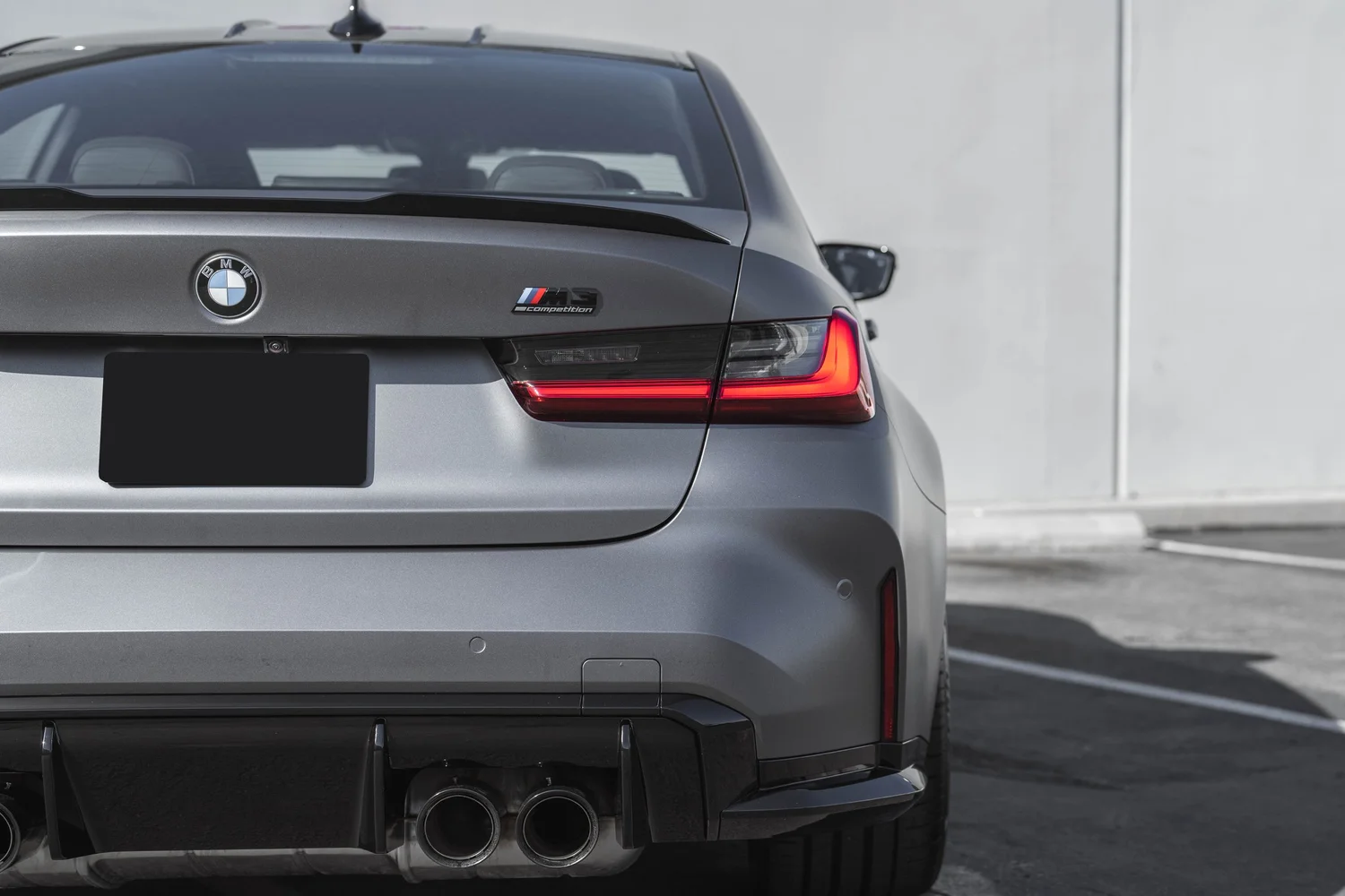 BMW M3 Matte Grey after Vinyl Wrap, rear diffuser and exhaust detail