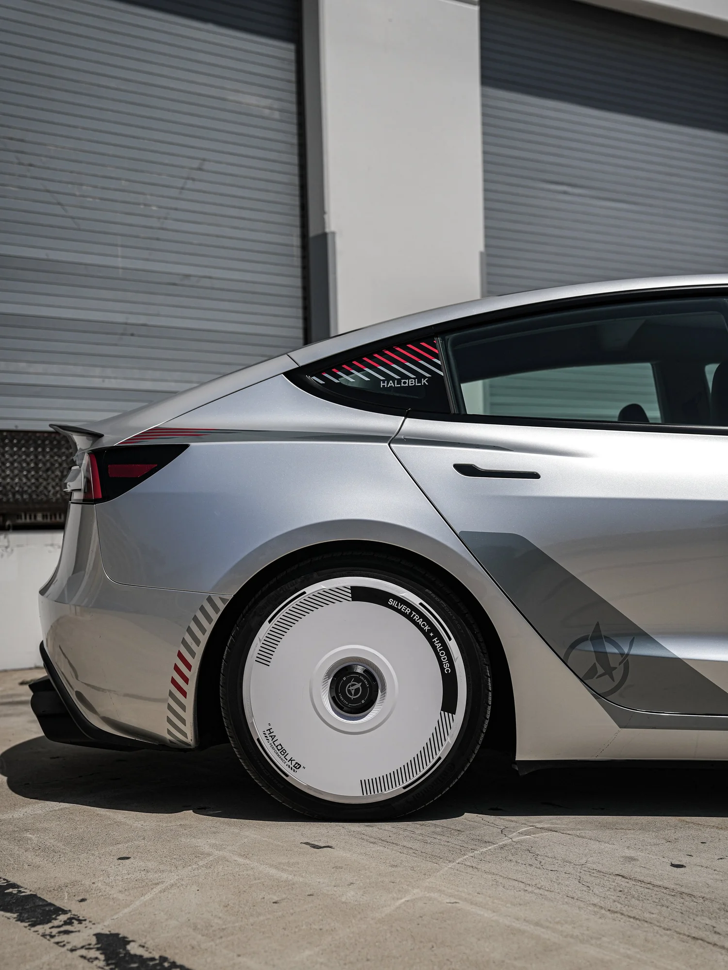 Tesla Model 3 Halo Edition Custom Wrap after Vinyl Wrap, rear-quarter and wheel view