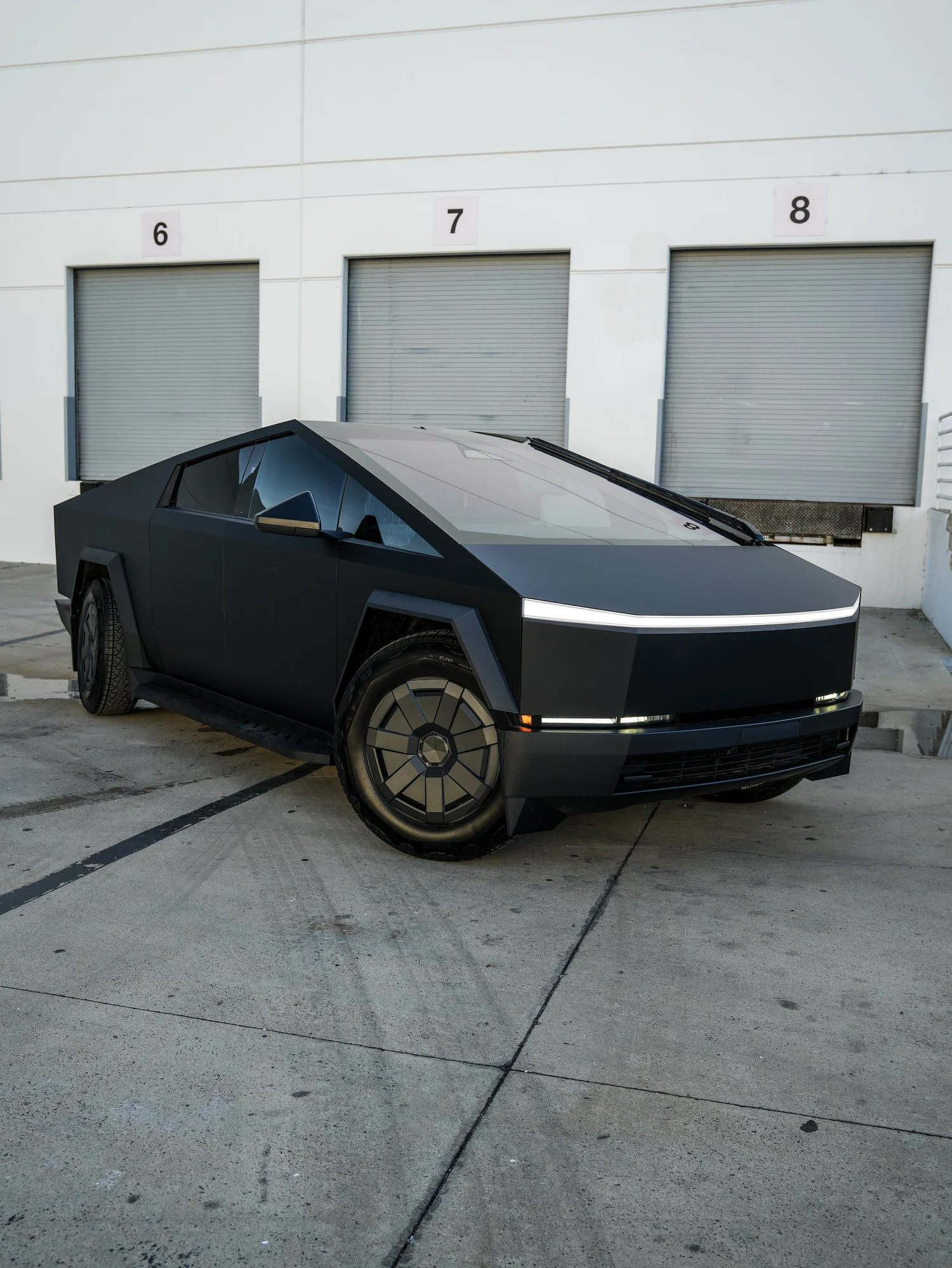 Tesla Cybertruck front three-quarter finished view after PROTEK matte black PPF and window tint