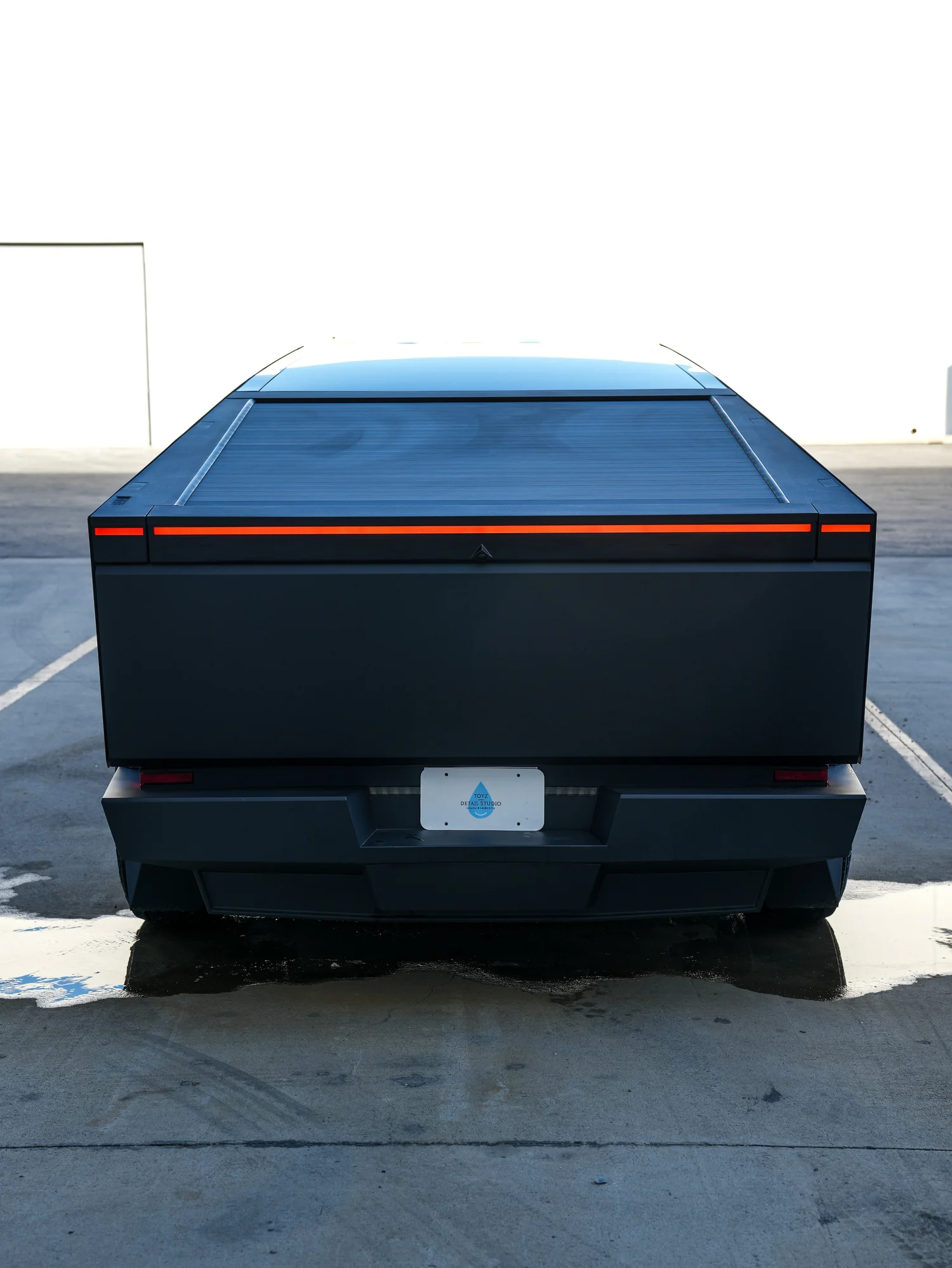 Tesla Cybertruck centered rear finished view with full light bar after PROTEK matte black PPF and window tint