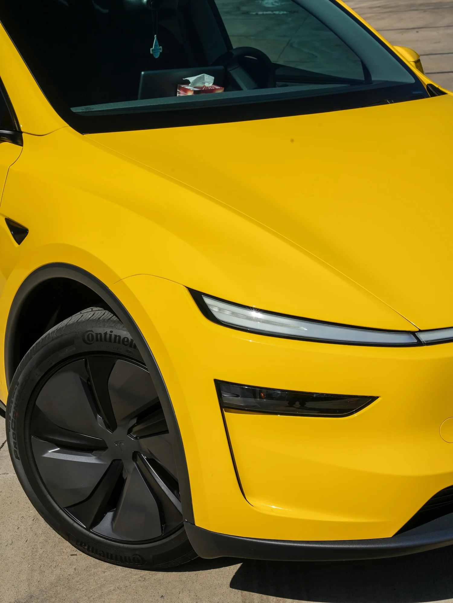 Tesla Model Y Vegas Yellow vinyl wrap, front wheel and hood detail