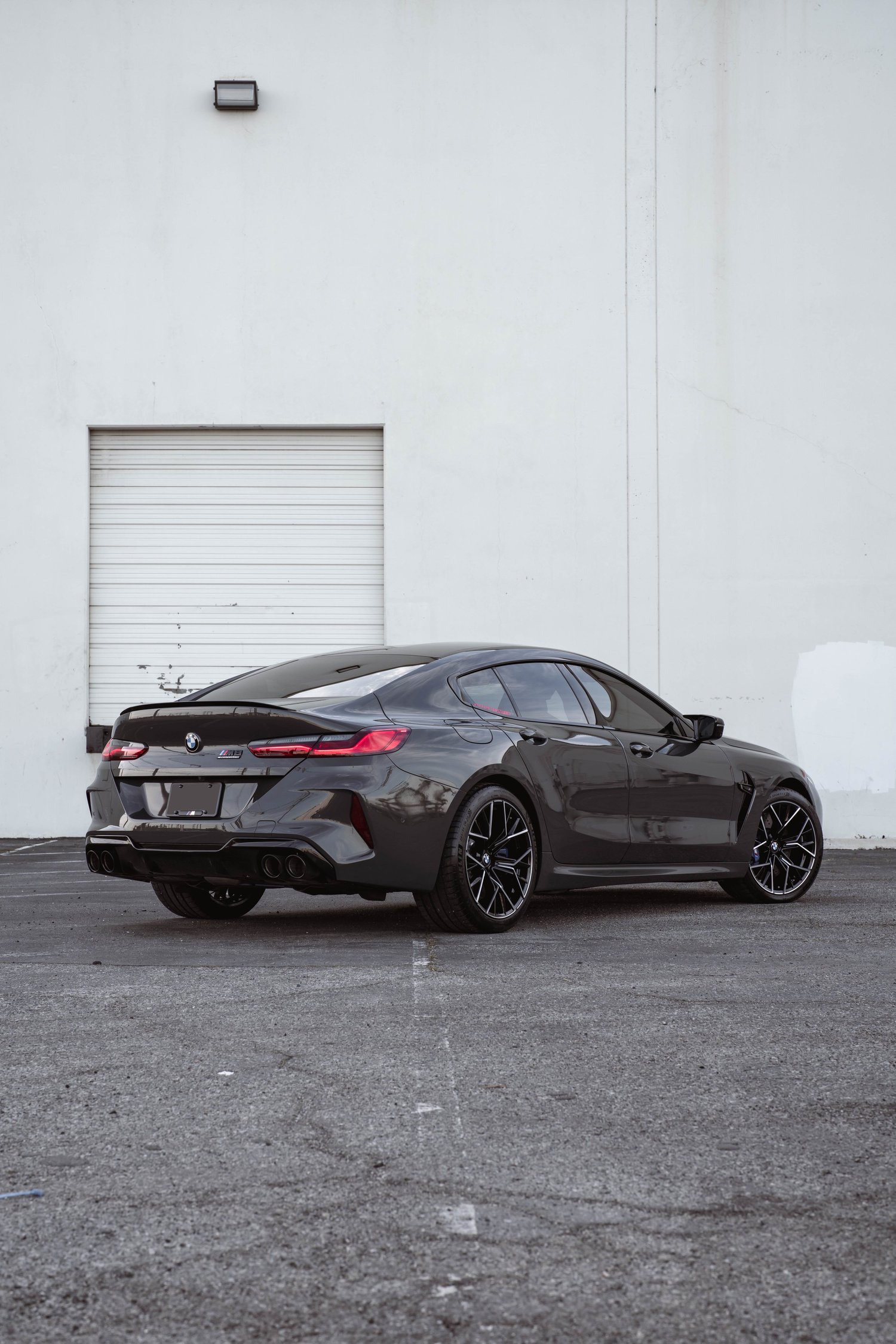 BMW M8 after Paint Protection Film (PPF), Window Tint and Ceramic Coating, low-angle rear view