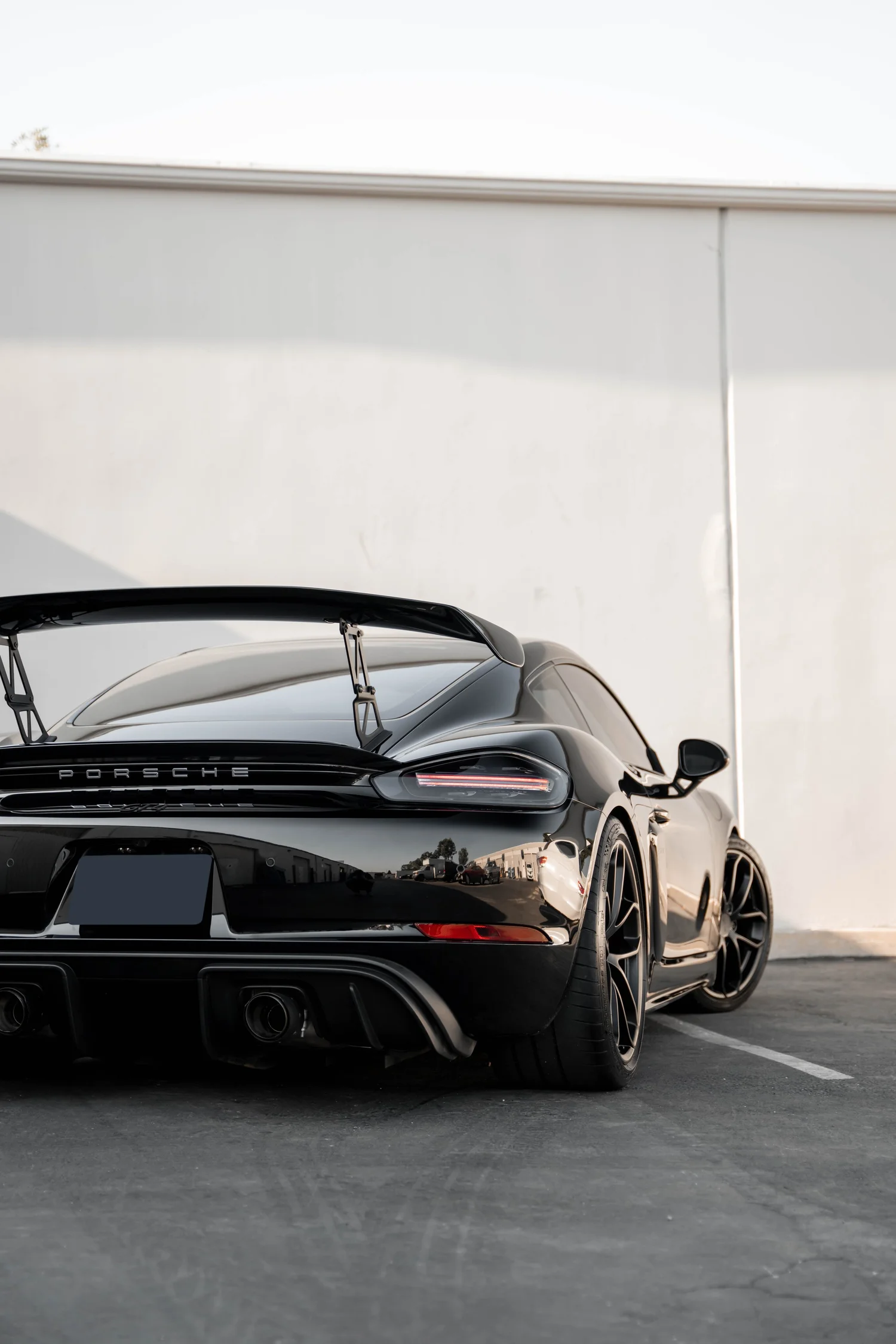 Porsche 718 Cayman GT4 after Paint Protection Film (PPF), Window Tint and Ceramic Coating, low-angle rear view