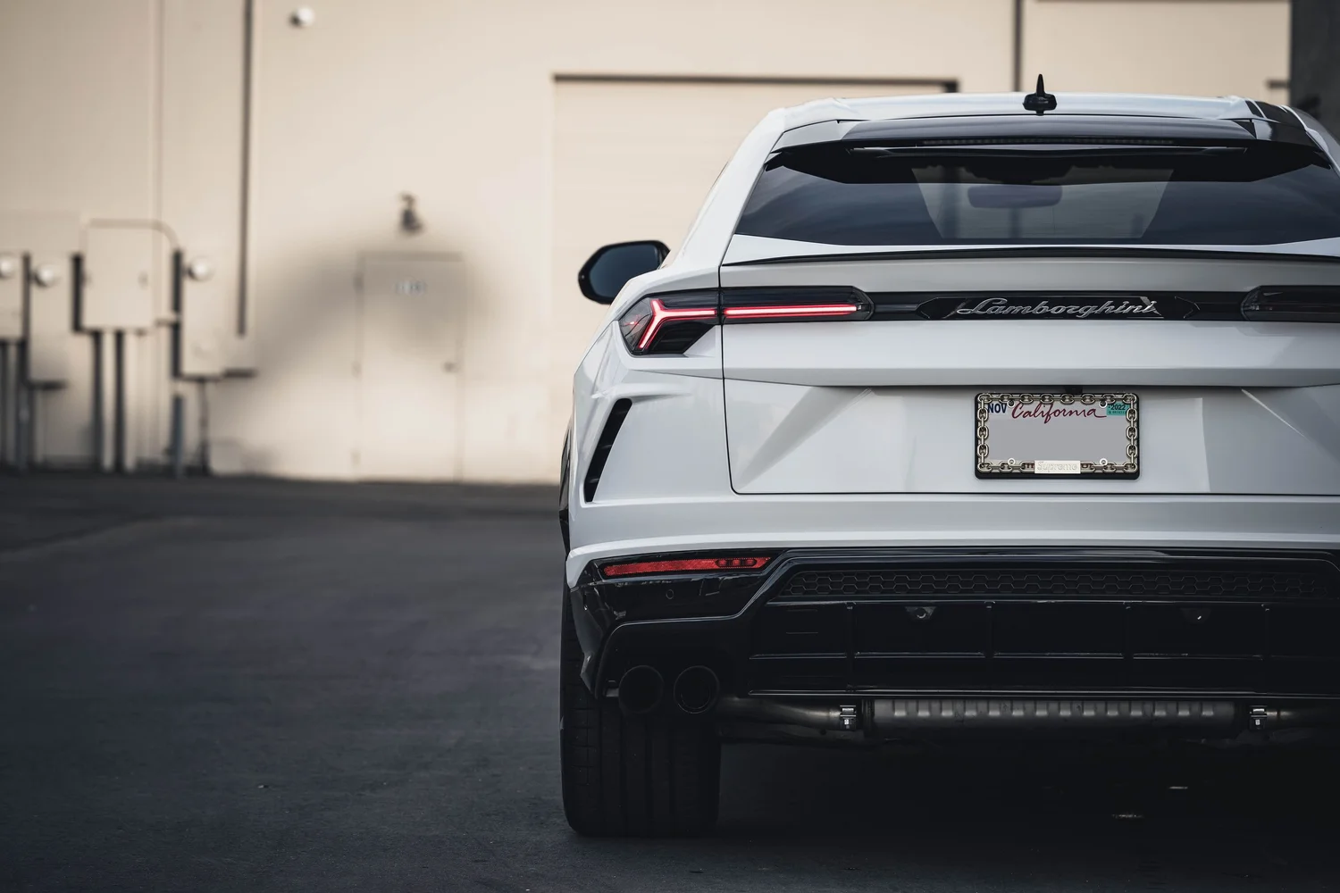 Lamborghini Urus Custom Project after Vinyl Wrap, low-angle rear view
