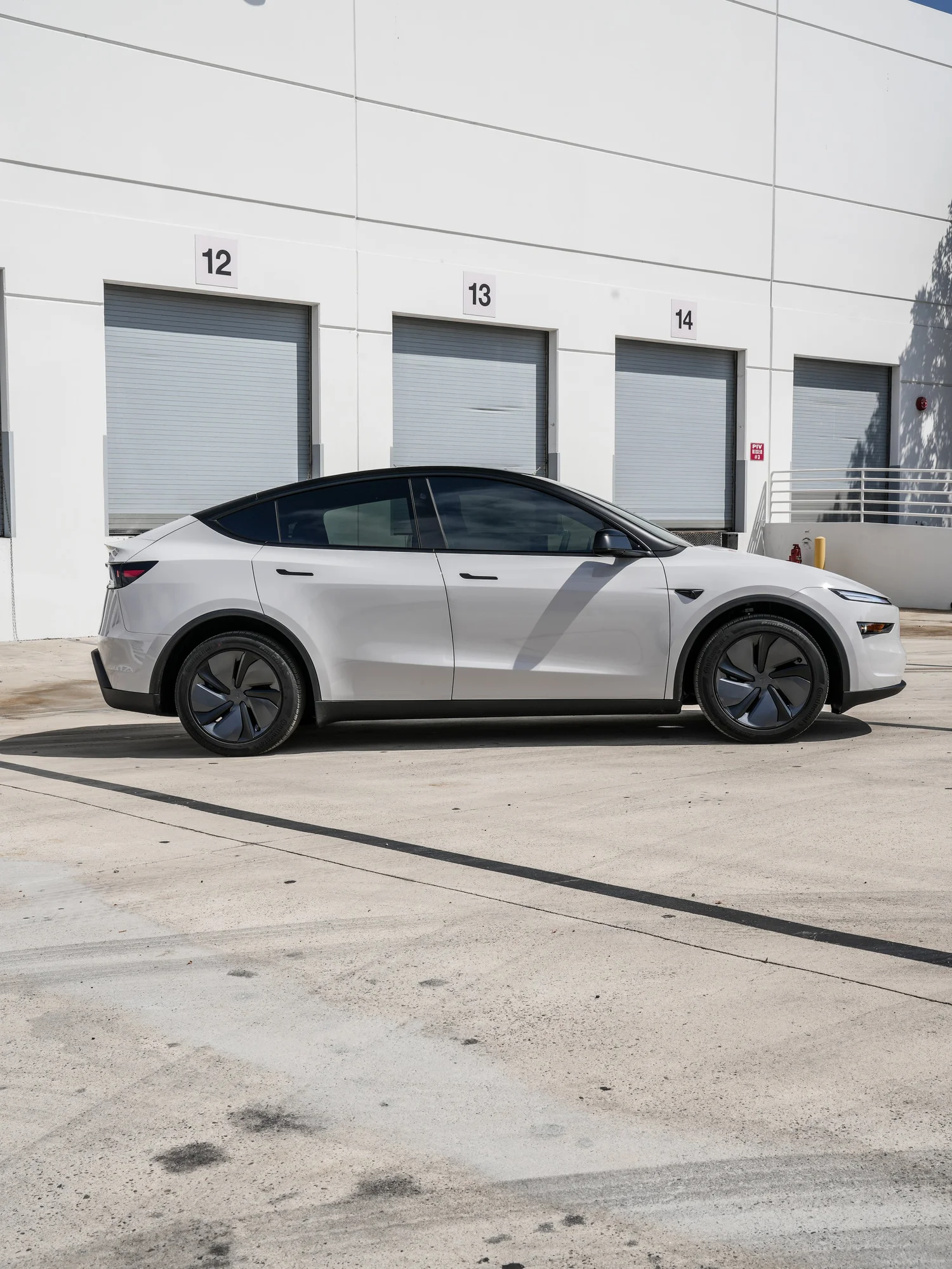 Tesla Model Y Chalk Grey Wrap after Vinyl Wrap, left-side profile