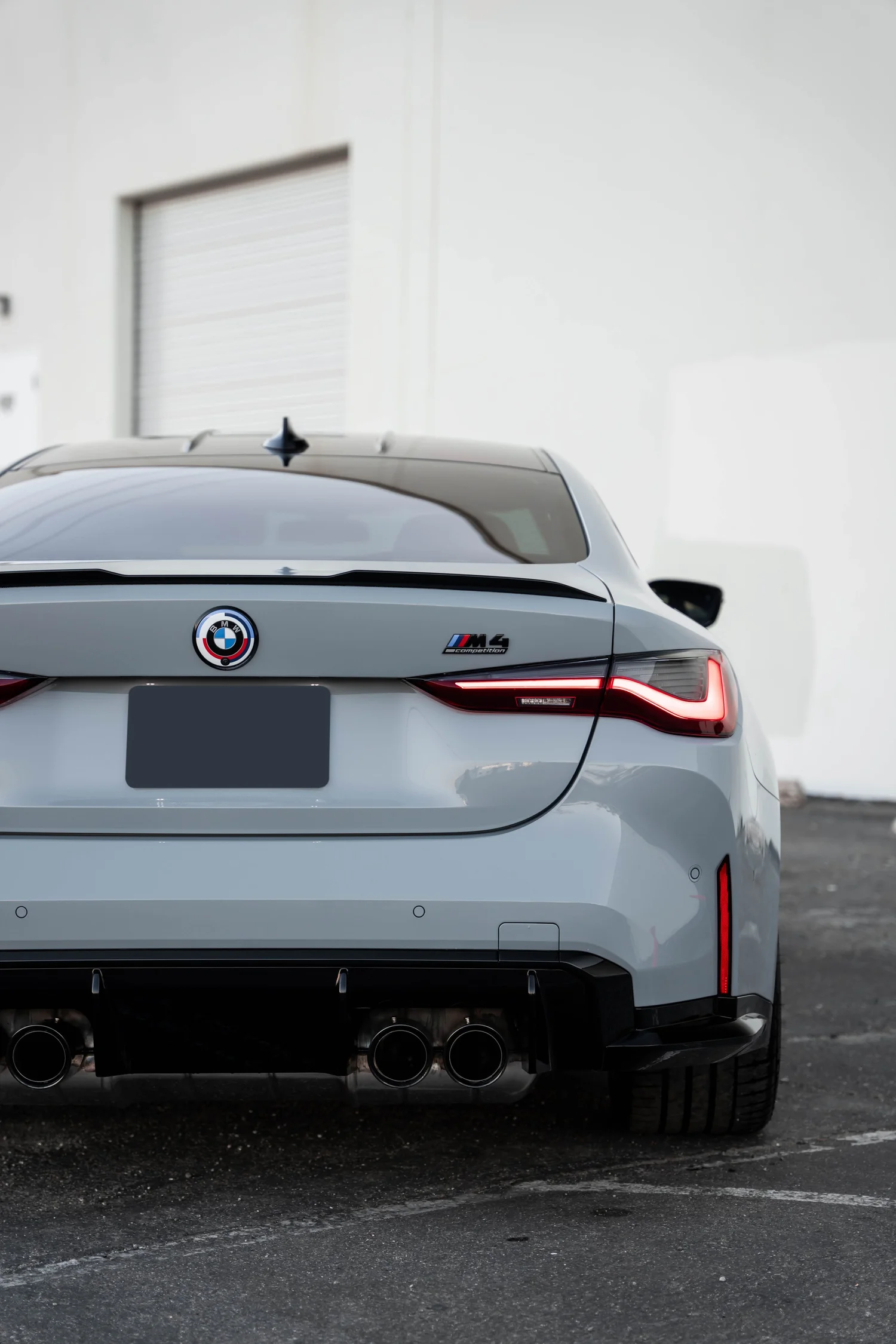 BMW M4 after Paint Protection Film (PPF), Window Tint and Ceramic Coating, rear body and taillight view