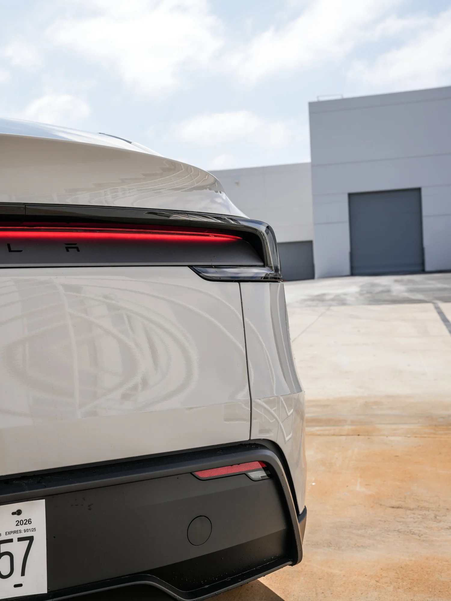 Tesla Model Y Chalk Grey Wrap after Vinyl Wrap, rear body and taillight view