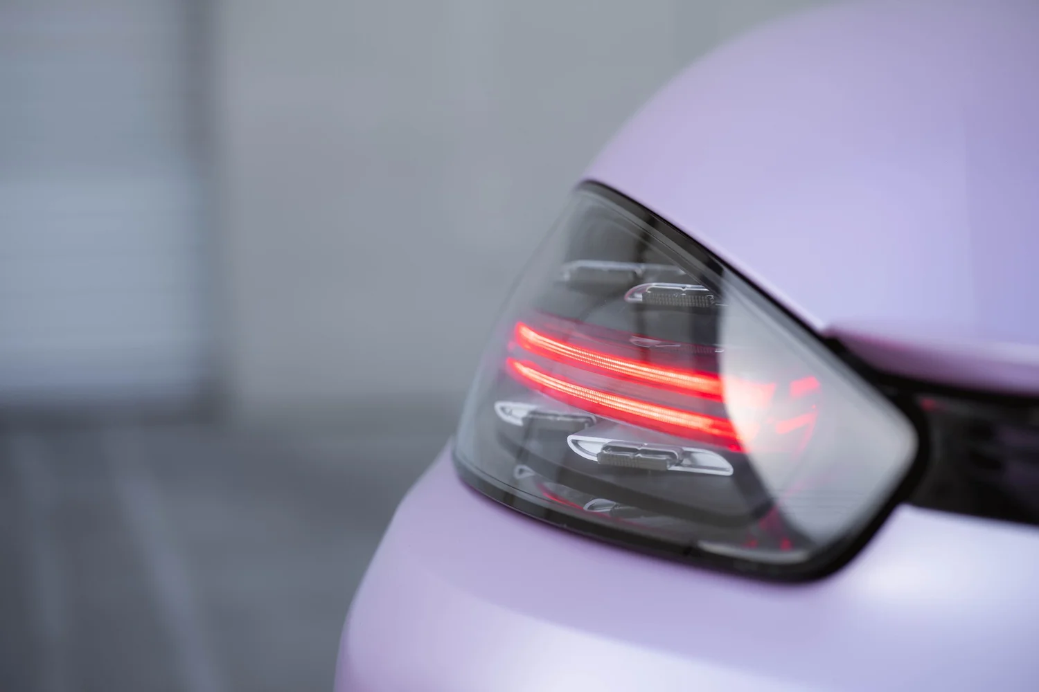 Porsche 718 Boxster Matte Purple Pink after Vinyl Wrap, rear body and taillight view