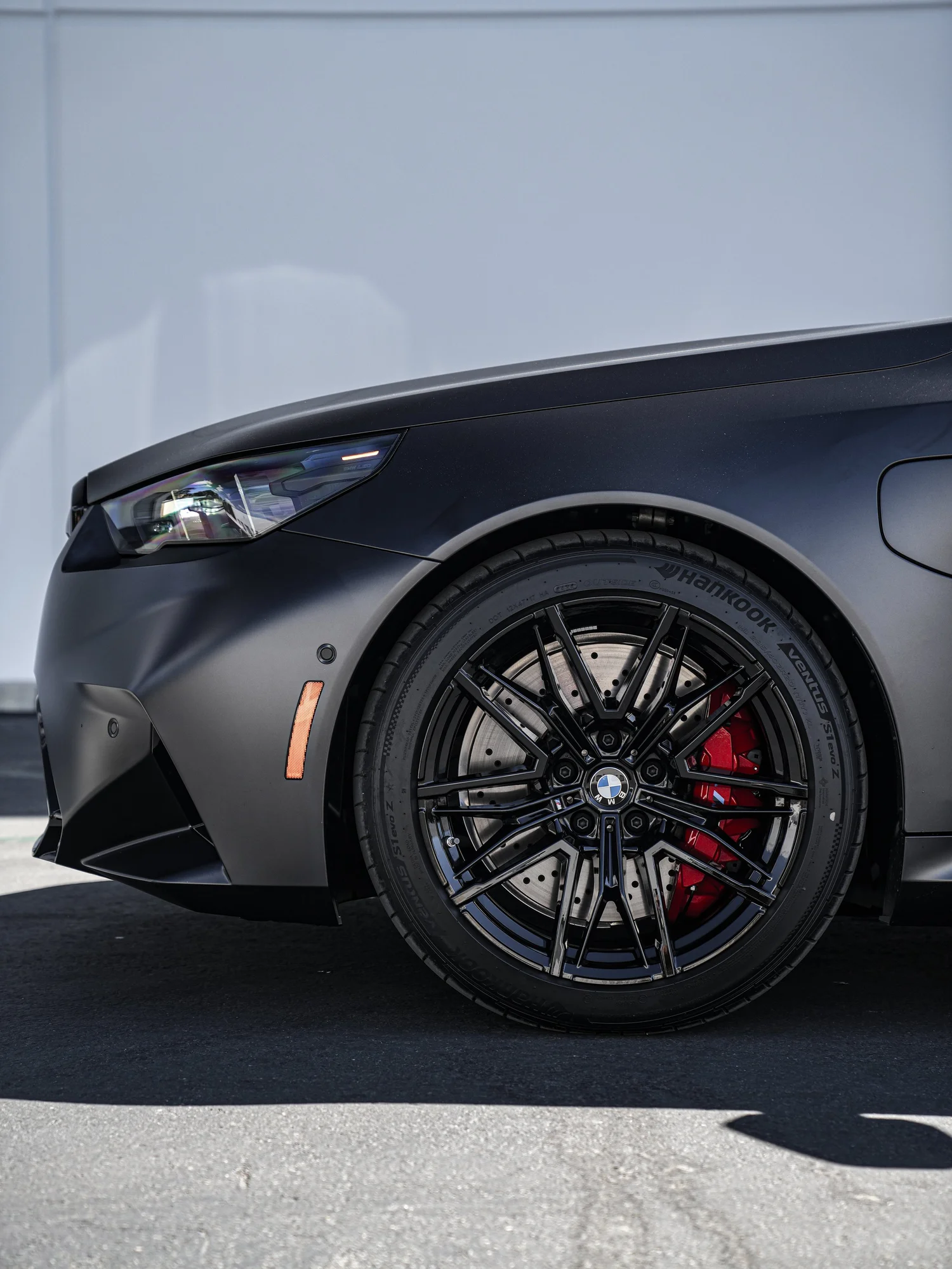 BMW G90 M5 after Matte PPF, Window Tint and Ceramic Coating, front wheel and body view