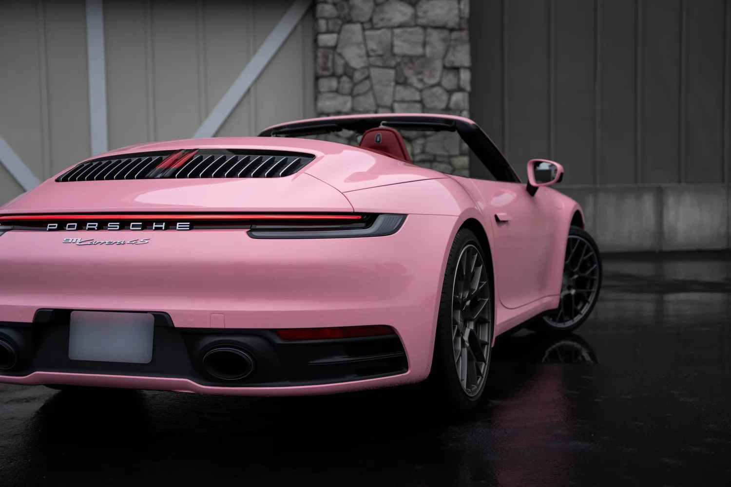 Porsche 911 Sakura Pink after Vinyl Wrap, rear-right three-quarter view