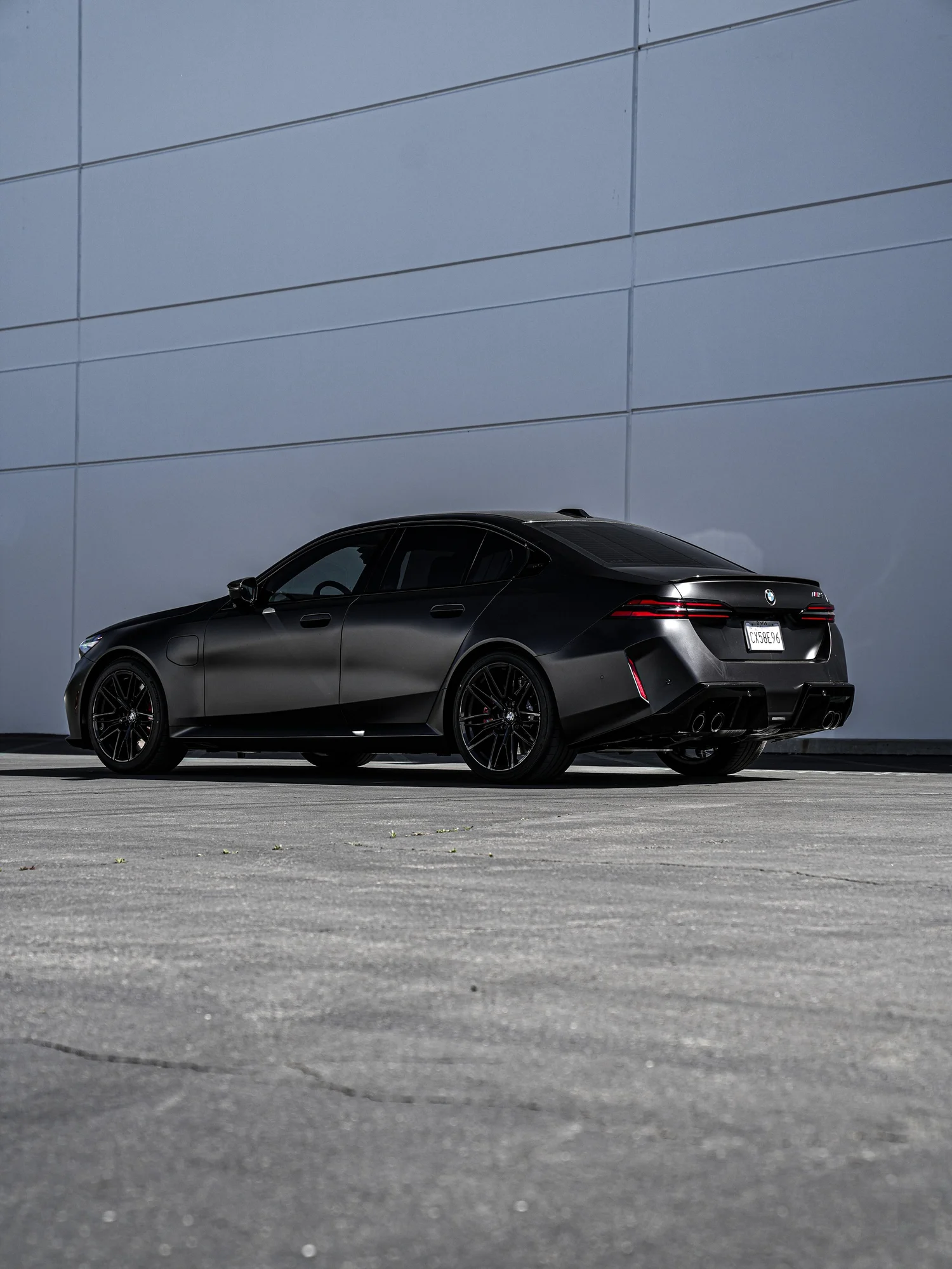 BMW G90 M5 after Matte PPF, Window Tint and Ceramic Coating, rear-left three-quarter view
