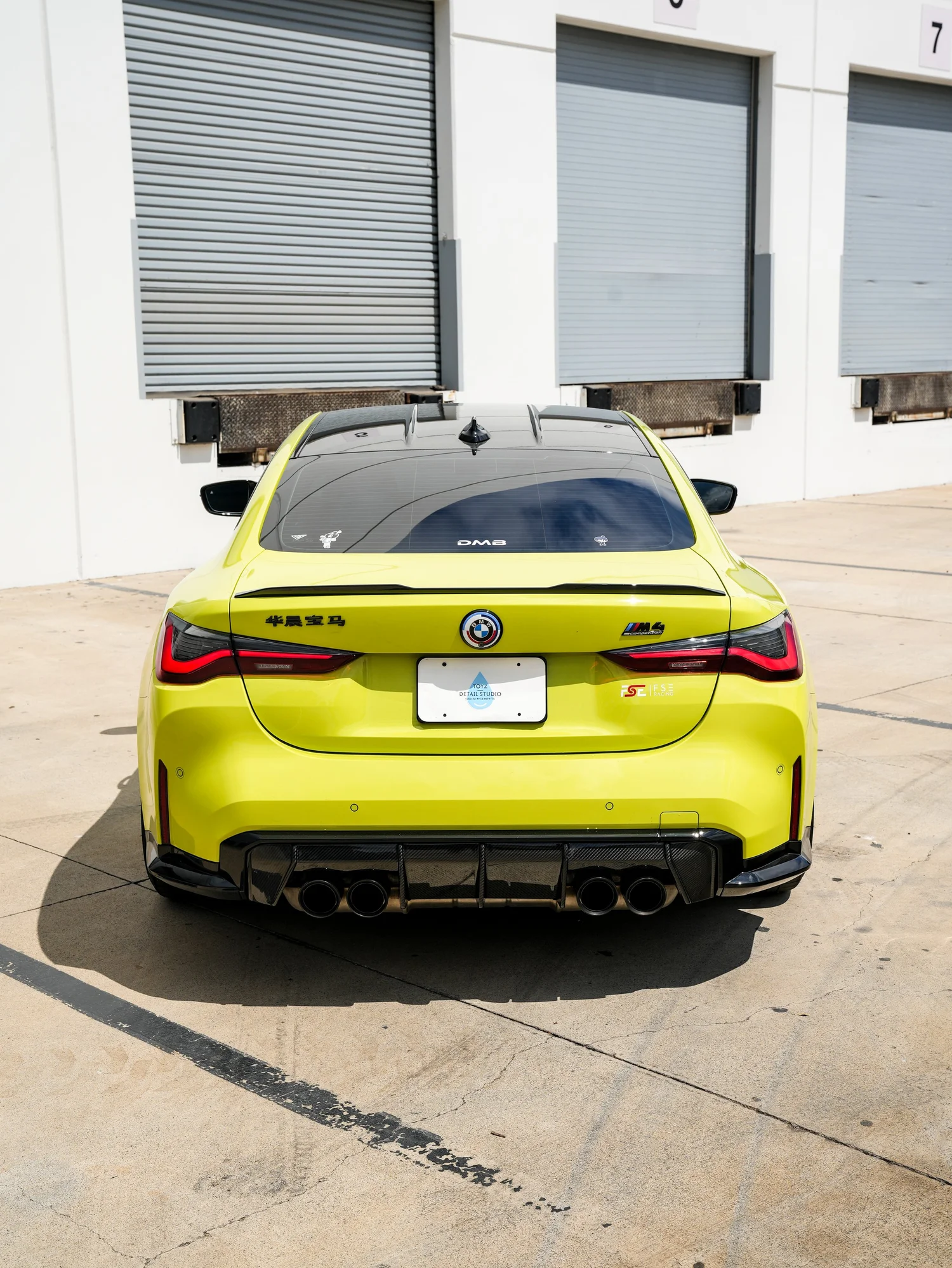 BMW M4 after Paint Protection Film (PPF), rear-right three-quarter view