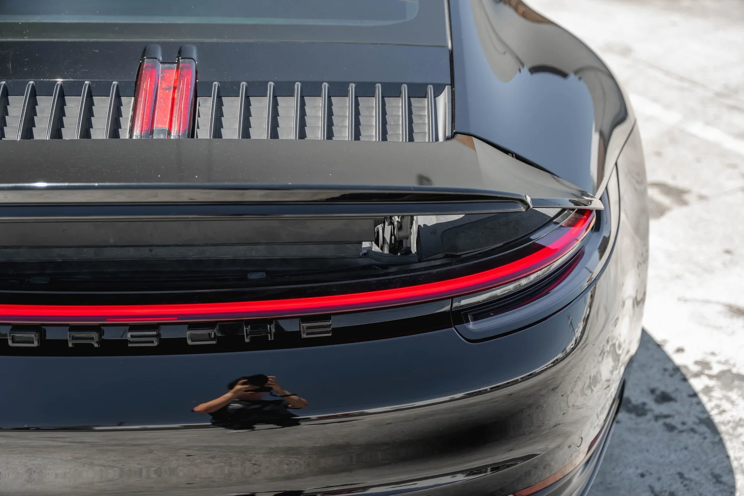 Porsche 911 Carrera S (992.1) after Paint Protection Film (PPF) and Ceramic Coating, rear body and taillight view