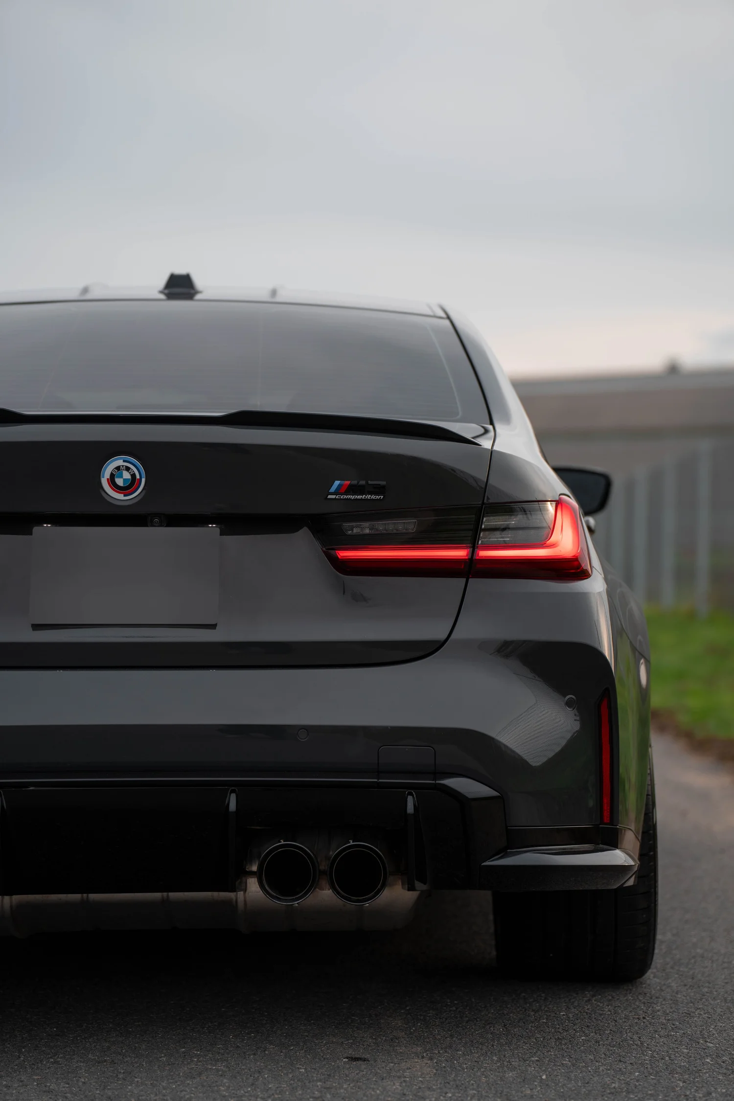 Dravit Grey BMW M3 after Paint Protection Film (PPF), Window Tint and Ceramic Coating, low-angle rear view