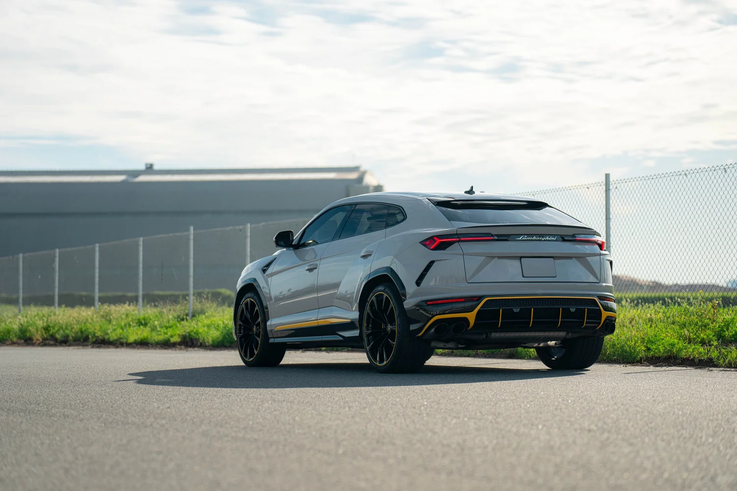 Lamborghini Urus Chalk after Vinyl Wrap, wide rear three-quarter view