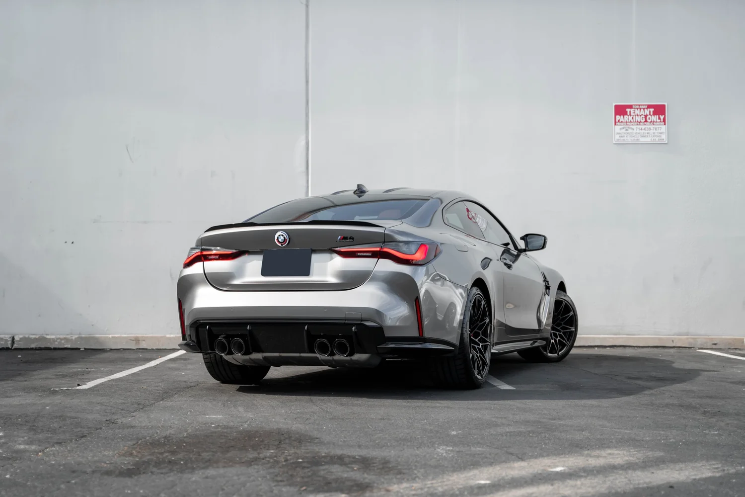 BMW M4 Silver Vinyl Wrap, rear three-quarter view