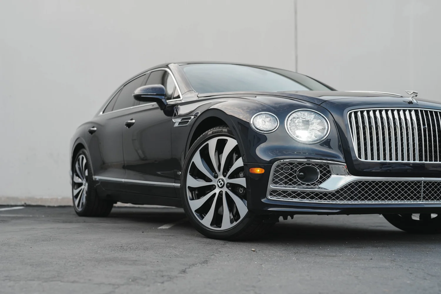 Bentley Flying Spur after Paint Protection Film (PPF), Window Tint and Ceramic Coating, front wheel and body view