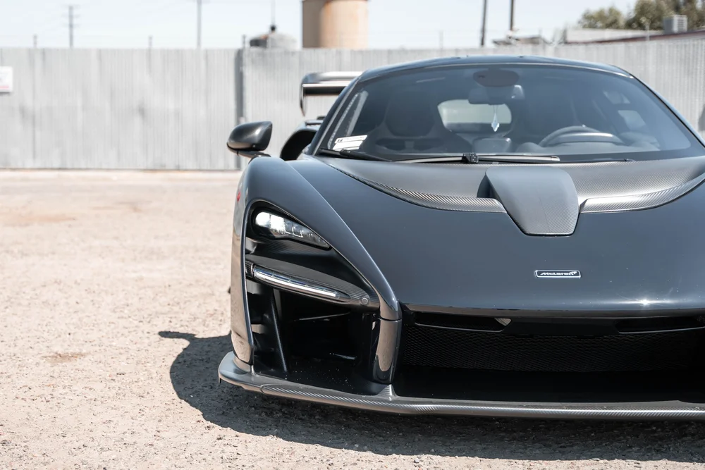 McLaren Senna closer front view showing the headlight, hood and deep intake