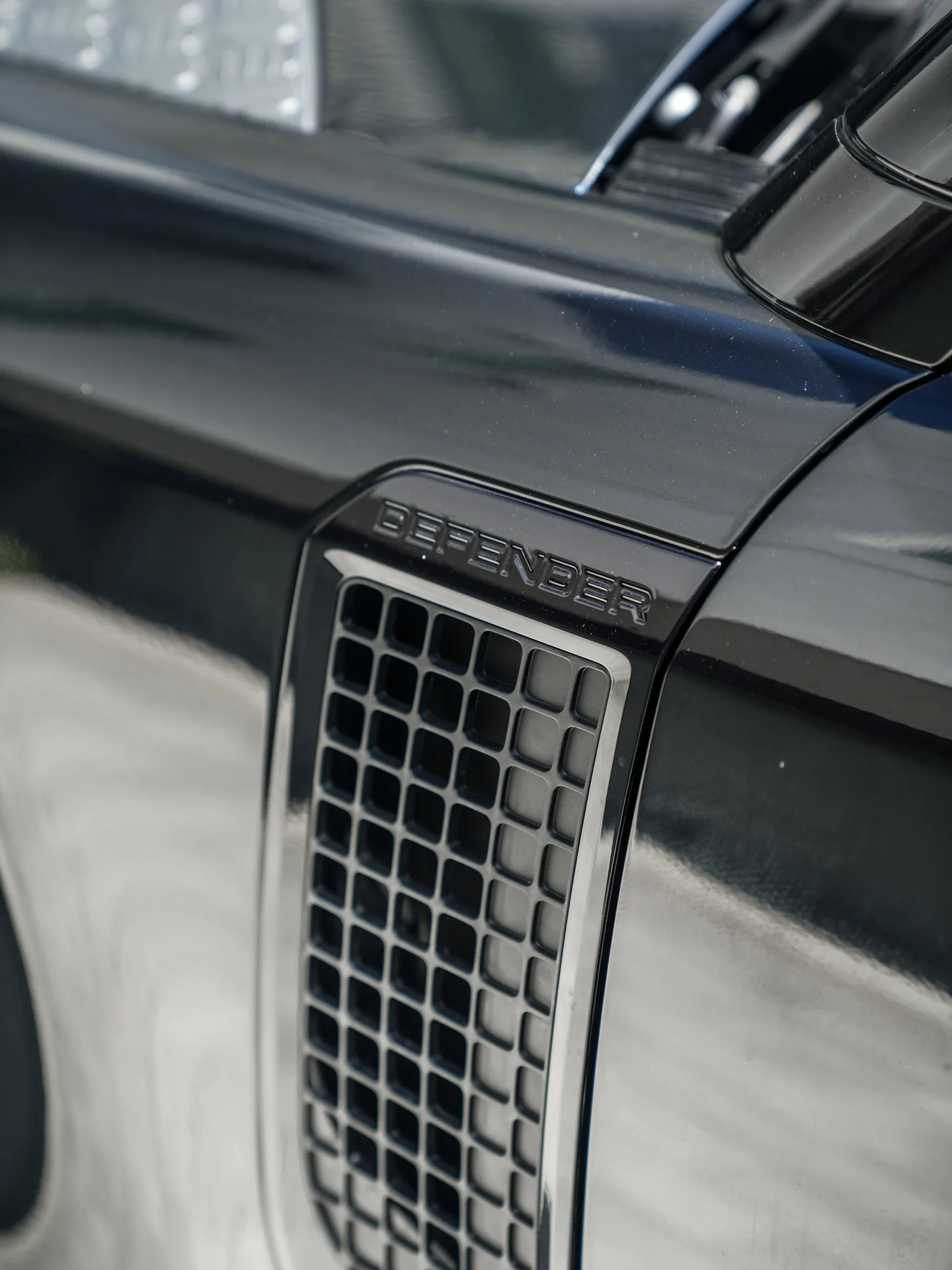 Land Rover Defender after Paint Protection Film (PPF) and Window Tint, front-corner view