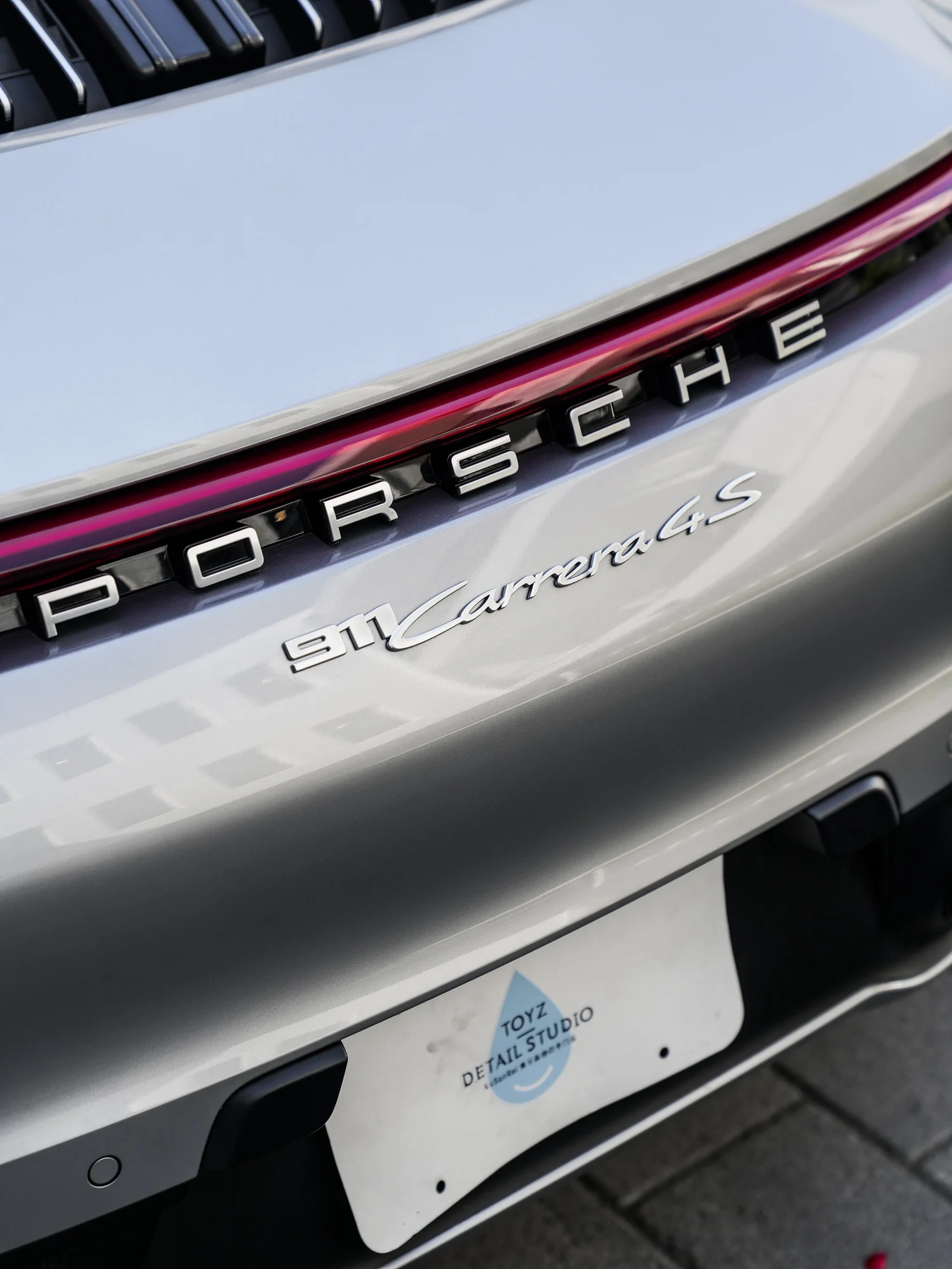 Porsche 911 after Paint Protection Film (PPF), film-edge and surface-finish detail
