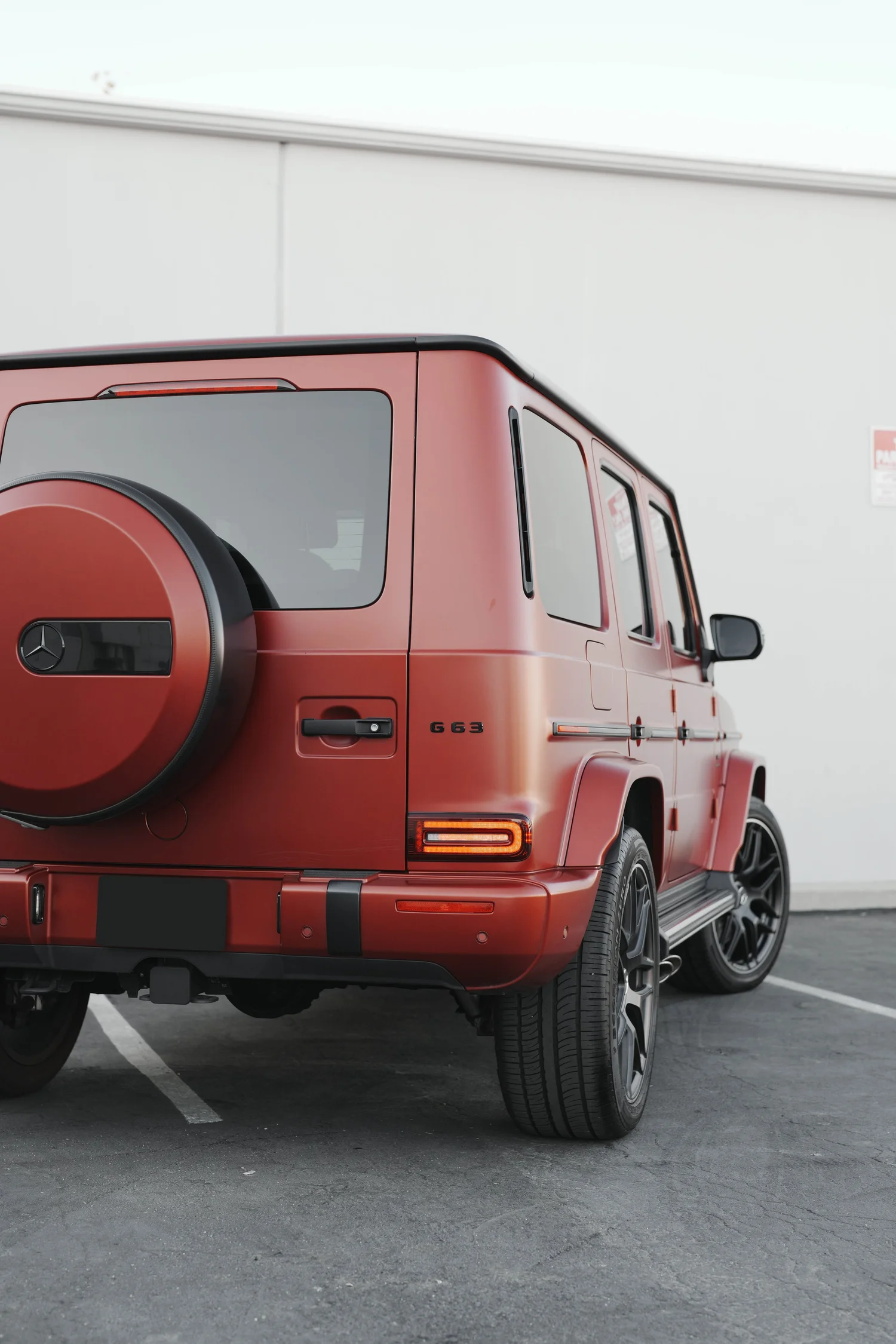Red Mercedes-AMG G 63 after Matte PPF, Window Tint and Ceramic Coating, tight rear three-quarter view