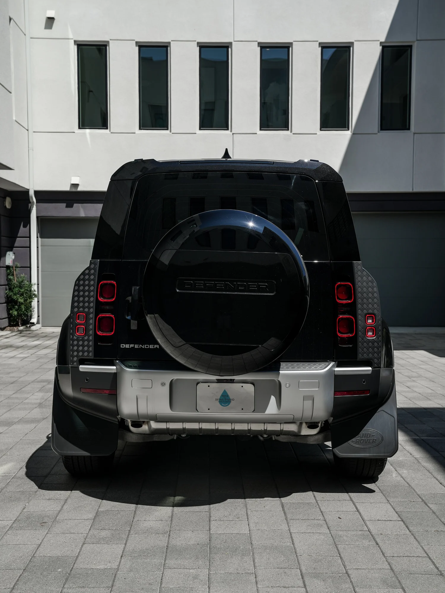 Land Rover Defender after Paint Protection Film (PPF) and Window Tint, direct rear view