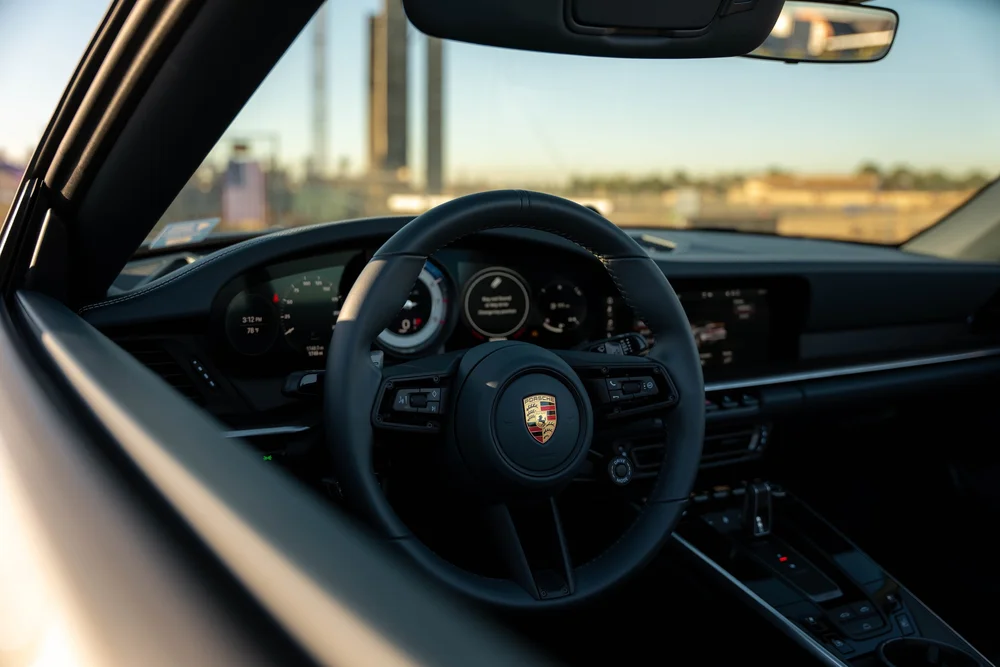 Chalk Porsche 911 Turbo S, cockpit view of steering wheel, instruments and center console