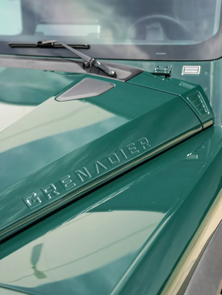 GRENADIER hood lettering and windshield-wiper detail on the green INEOS Grenadier.