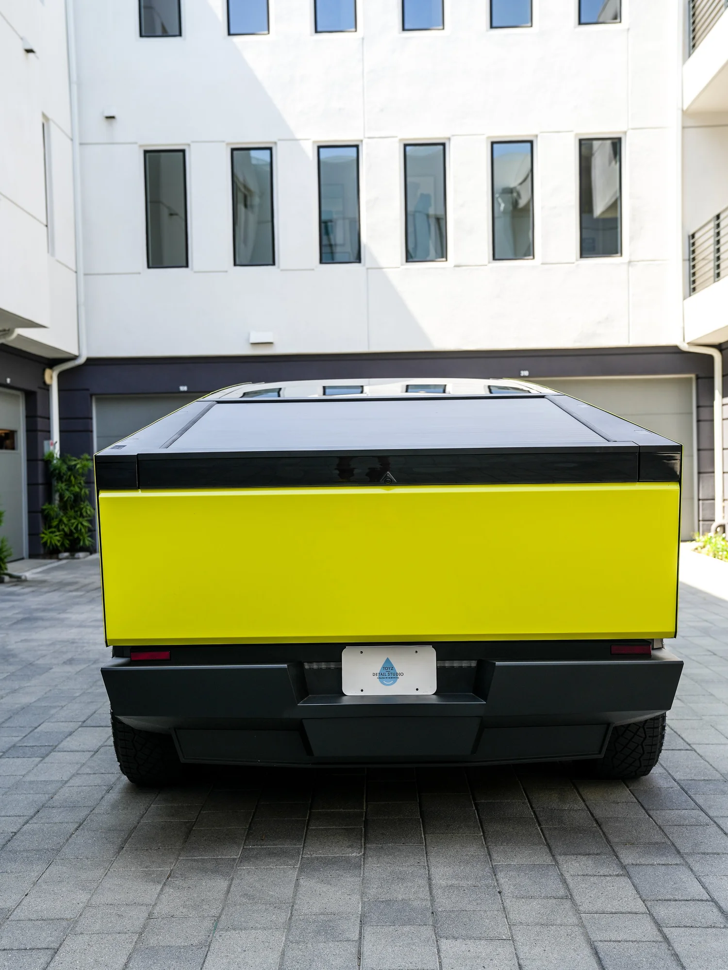Tesla Cybertruck Inozetek Racing Yellow after Window Tint and Vinyl Wrap, direct rear view